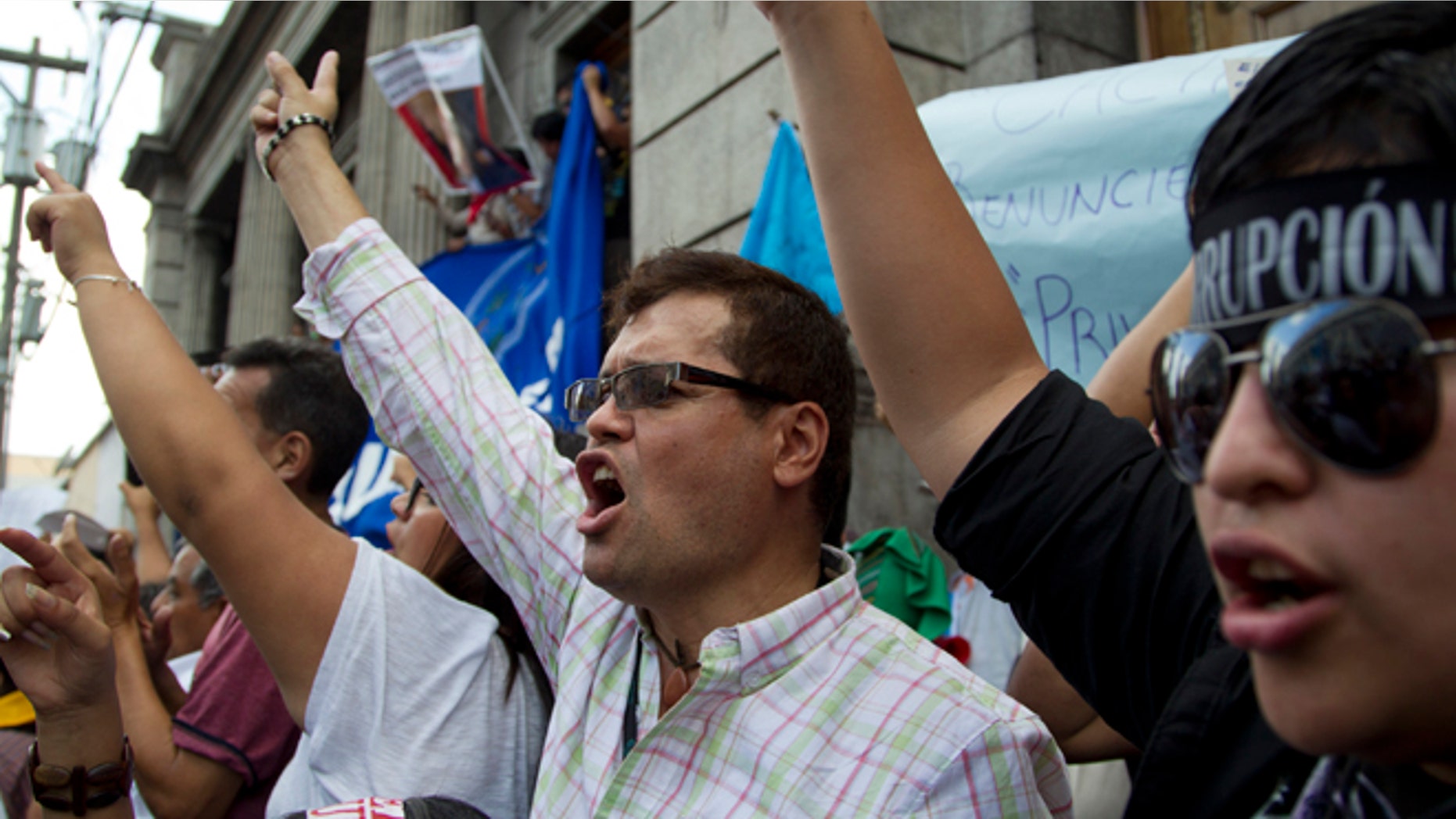 Protesters demand the resignation of Guatemalan President Otto Perez Molina Saturday, May 9, 2015.