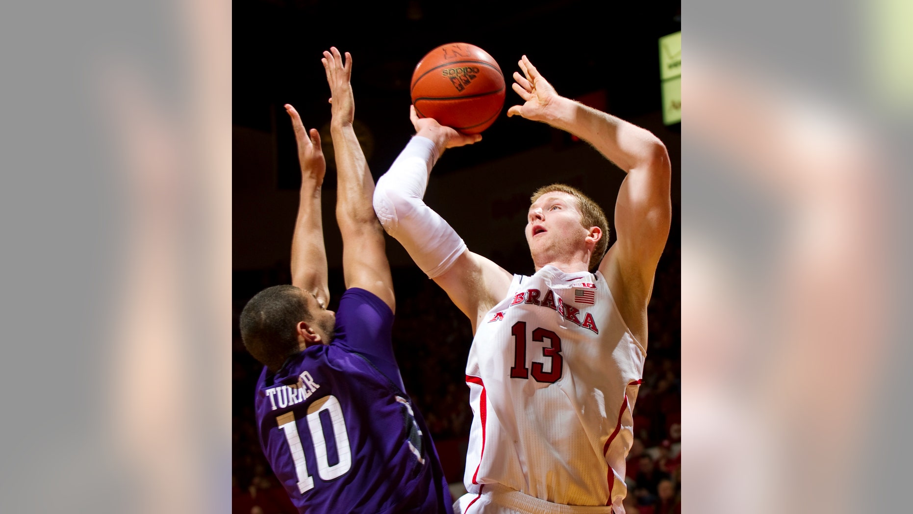 Nebraska's Brandon Ubel (13) shoots over Northwestern's Mike Turner (10) during the first half of their NCAA college basketball game, Saturday, Jan. 26, 2013, in Lincoln, Neb. (AP Photo/The Journal-Star, Matt Ryerson) LOCAL TV OUT; KOLN-TV OUT; KGIN-TV OUT; KLKN-TV OUT