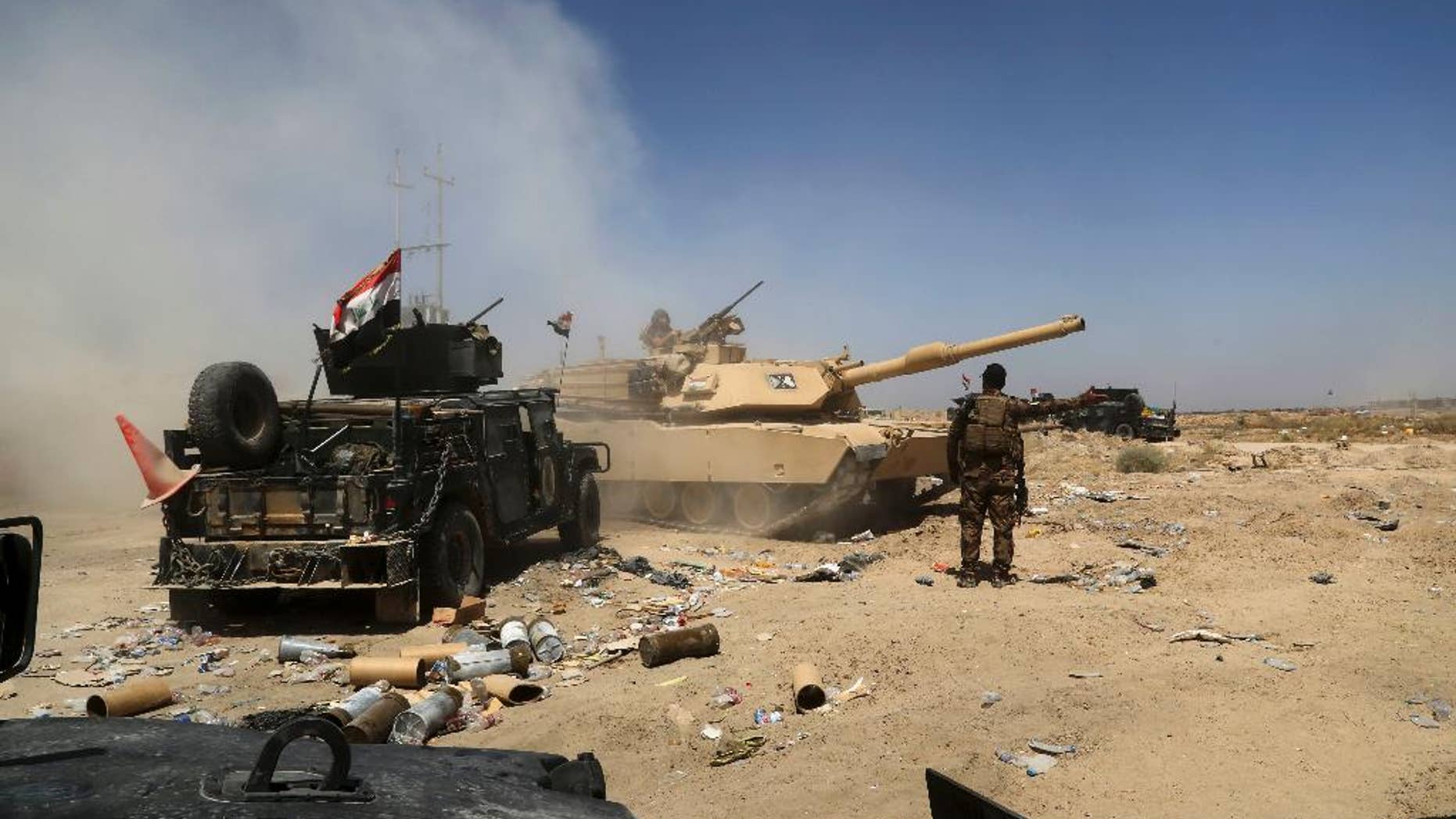 Major drug makers helped fund Iraqi militias that attacked U.S. troops, a lawsuit alleged Tuesday. Pictured: Iraqi military forces engage in operations in an undated photo.