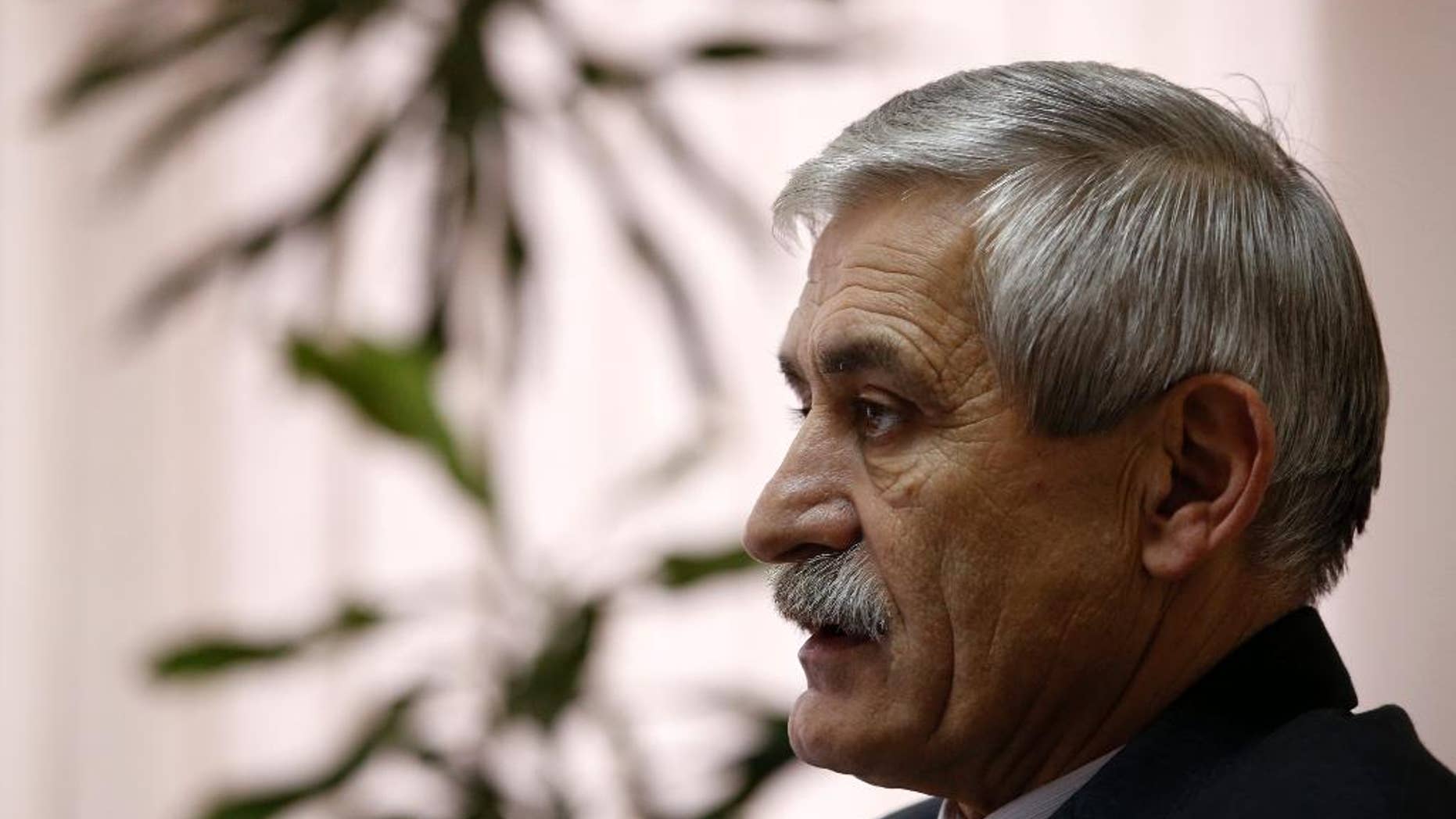 The head of a Serbian arms factory Milojko Brzakovic speaks during an interview with The Associated Press, in Belgrade, Serbia, Thursday, Dec. 10, 2015. Brzakovic of the Zastava arms factory told the Associated Press Thursday that the M92 semi-automatic pistol was traced after its serial number matched the one delivered to an American arms dealer in May 2013. (AP Photo/Darko Vojinovic)