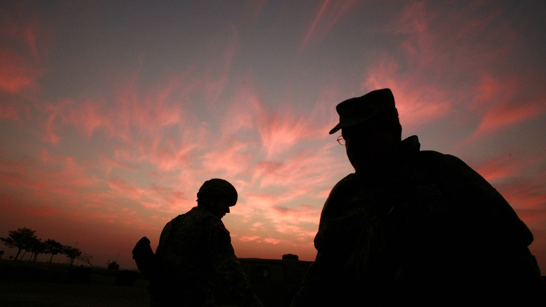 In this Jan. 25, 2007 file photo, the sun sets at a US military base Camp Liberty in Baghdad, Iraq.