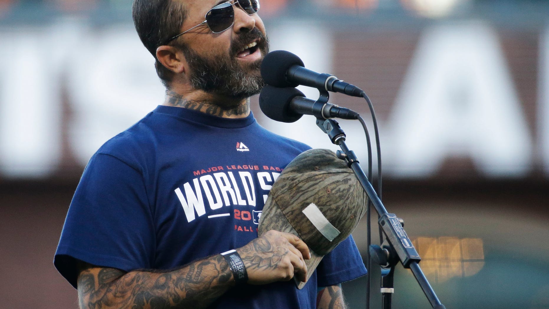 Recording artist Aaron Lewis performs the national anthem before Game 5 of baseball's World Series between the Kansas City Royals and the San Francisco Giants Sunday, Oct. 26, 2014, in San Francisco. (AP Photo/Matt Slocum)
