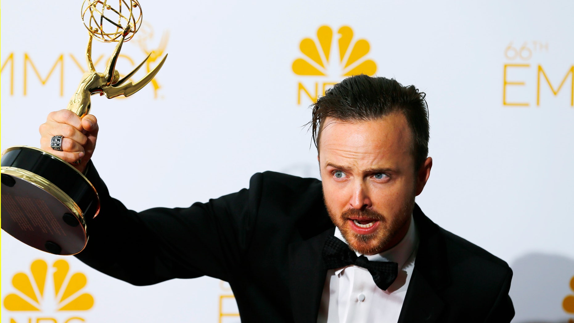 August 25, 2014. Aaron Paul poses with his Outstanding Supporting Actor in a Drama Series for "Breaking Bad" at the 66th Primetime Emmy Awards in Los Angeles.