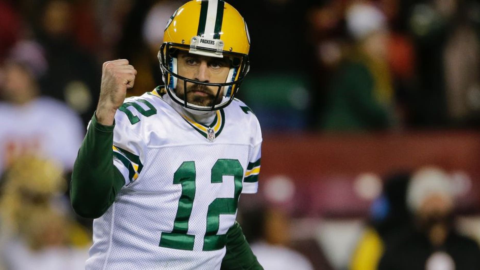 Green Bay Packers quarterback Aaron Rodgers (12) celebrates tight end Jared Cook's touchdown during the second half of an NFL football game against the Washington Redskins in Landover, Md., Sunday, Nov. 20, 2016. (AP Photo/Mark Tenally)