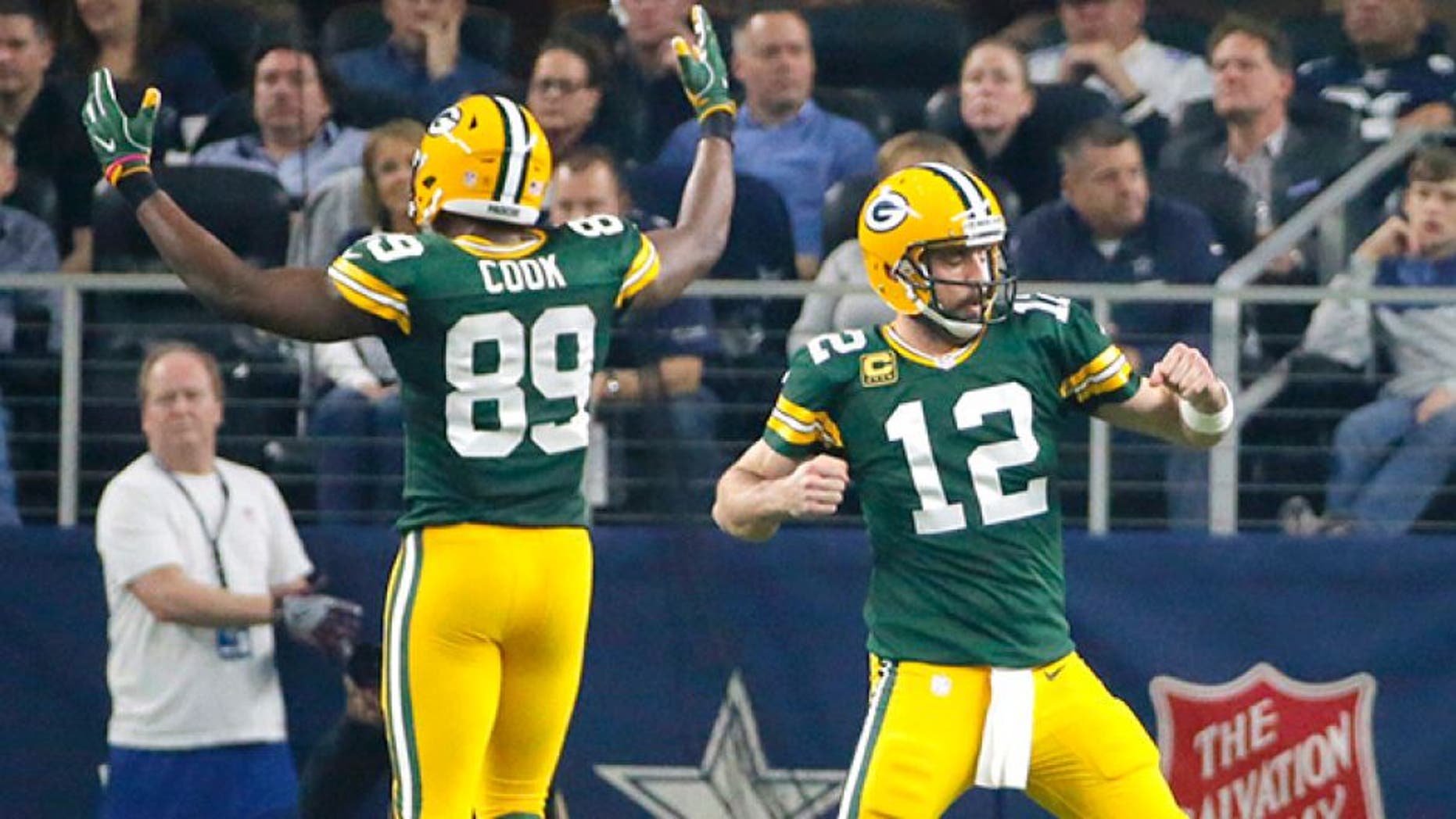 Green Bay Packers quarterback Aaron Rodgers (12) and Jared Cook (89) celebrate after a touchdown during the first half of an NFL divisional playoff football game against the Dallas Cowboys Sunday, Jan. 15, 2017, in Arlington, Texas. (AP Photo/Tony Gutierrez)