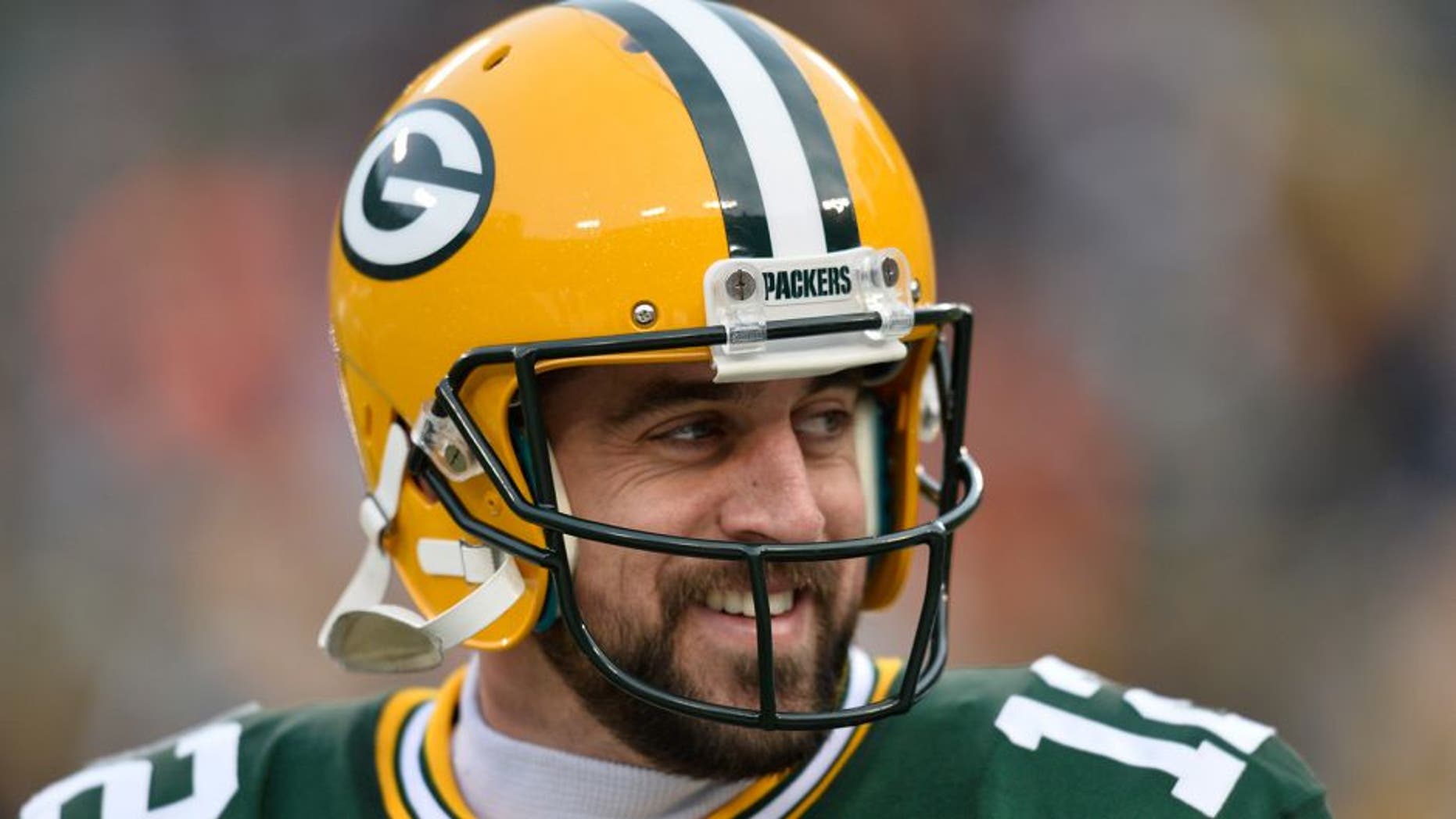 GREEN BAY, WI - NOVEMBER 30: Aaron Rodgers #12 of the Green Bay Packers warms up before the game against the New England Patriots at Lambeau Field on November 30, 2014 in Green Bay, Wisconsin. The Packers defeated the Patriots 26-21. (Photo by Brian D. Kersey/Getty Images)