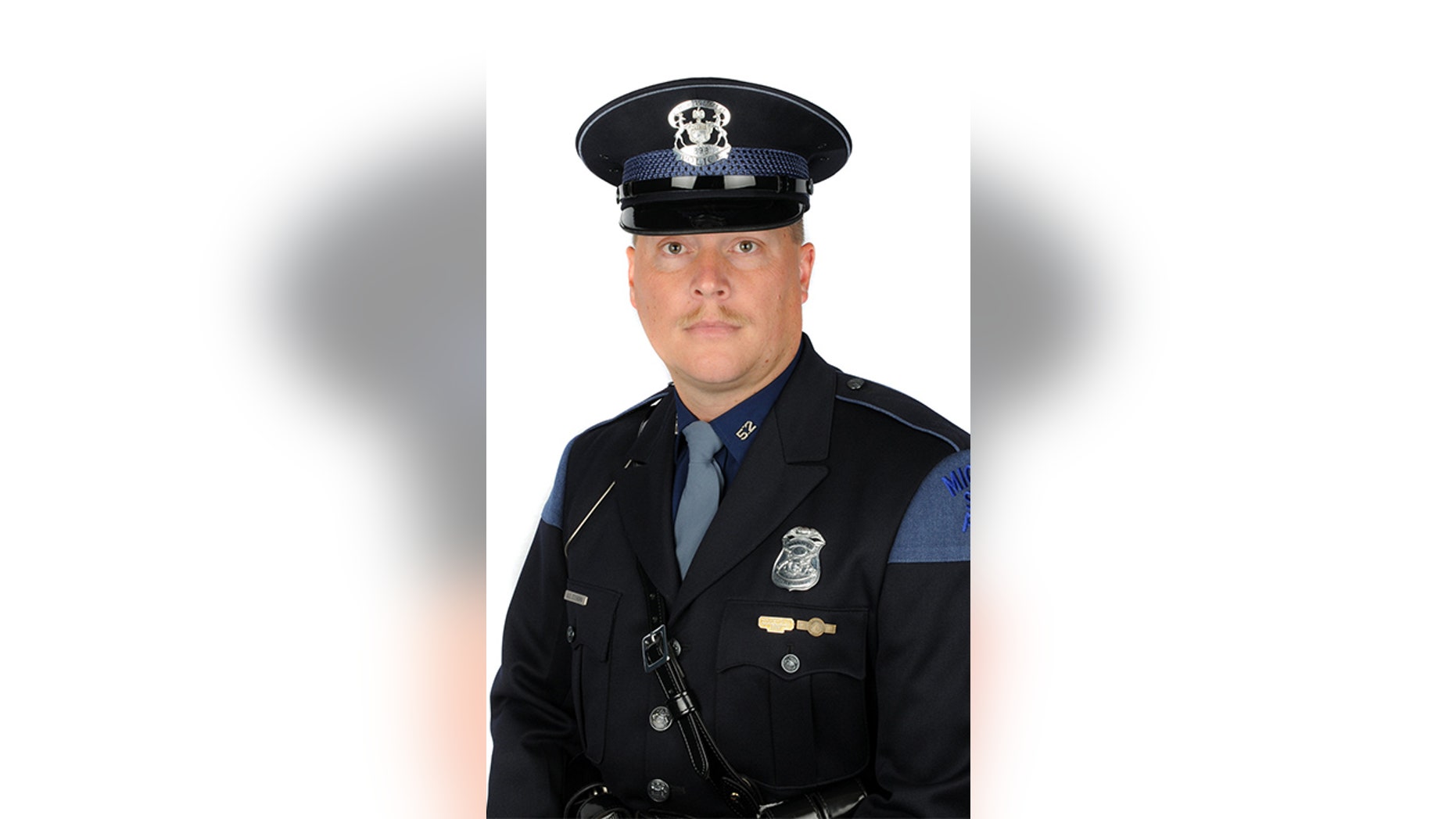 Detective Sgt. Aaron Steensma is in serious but stable condition at a medical center in Kalamazoo, Michigan, after being shot in the chest Wednesday morning while serving a search warrant.