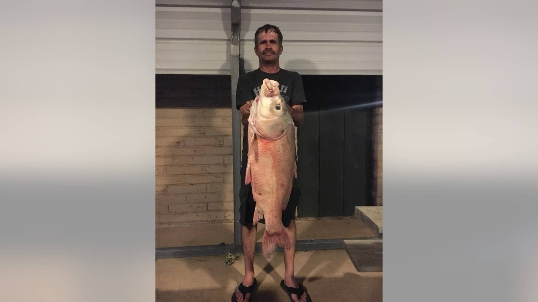 Joel Langston poses with his 28-pound catch.