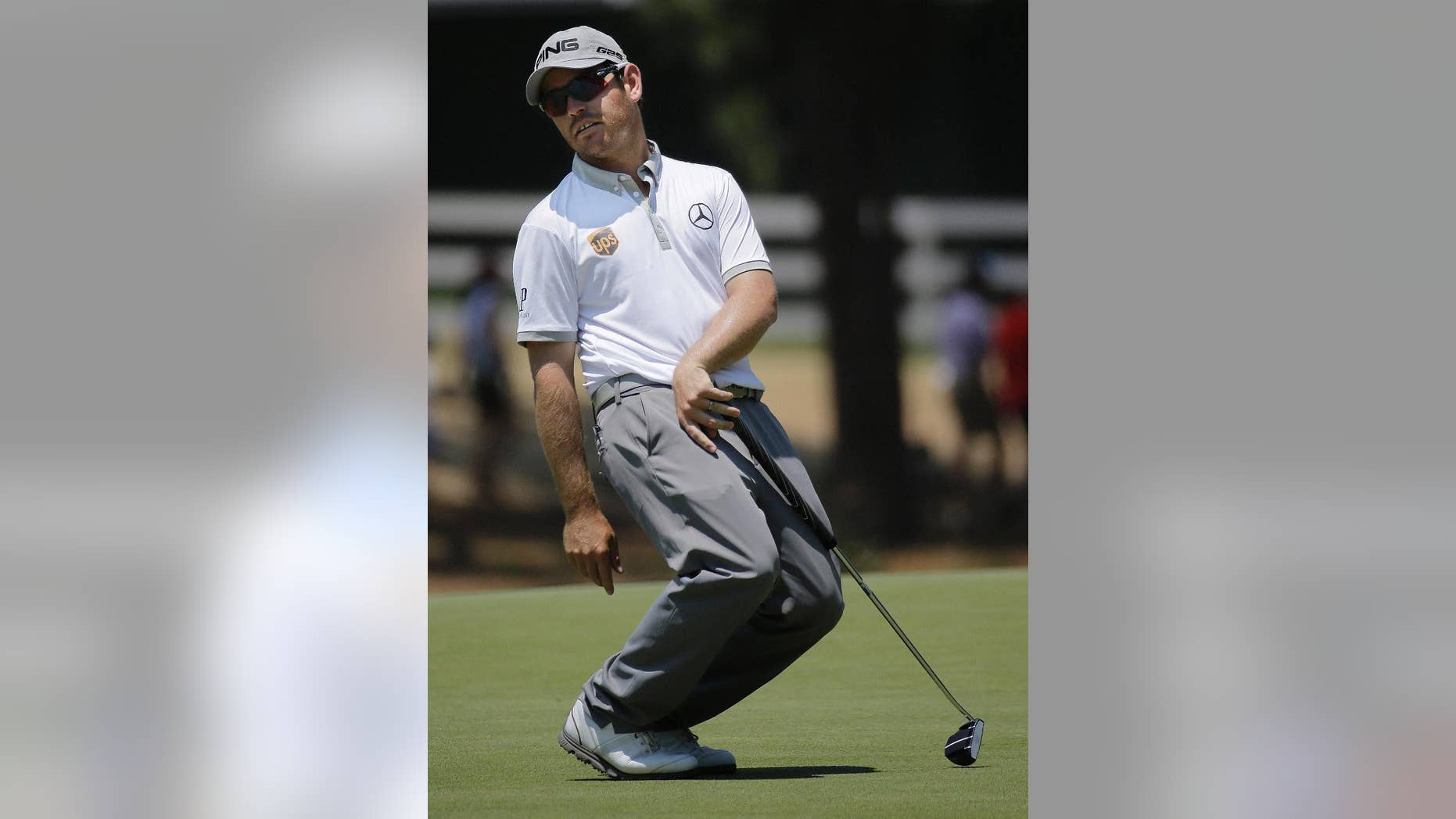 Louis Oosthuizen, of South Africa reacts after missing a putt on the 15th hole during the final round of the U.S. Open golf tournament in Pinehurst, N.C., Sunday, June 15, 2014. (AP Photo/Eric Gay)