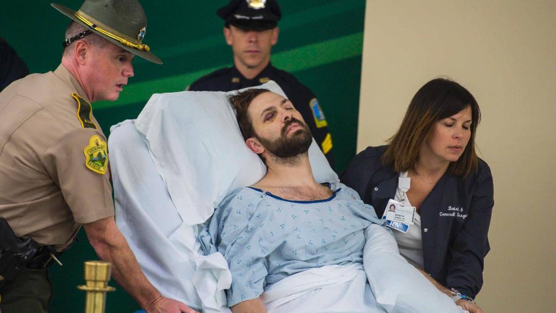FILE - In this Oct. 14, 2016 file photo, Steven Bourgoin is brought in to be arraigned in a makeshift courtroom at the University of Vermont Medical Center on five counts of second-degree murder in Burlington, Vt. The deaths of five teenagers in a fiery car wreck that police say was caused by Bourgoin, a wrong-way driver, has been removed from the list of the state’s highway fatalities for last year and has been reclassified as murder. (Glenn Russell/The Burlington Free Press via AP, Pool)