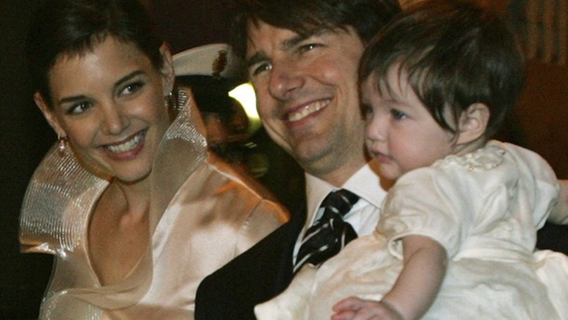 2006 FILE: Tom Cruise holds his daughter Suri just days before his wedding to Katie Holmes. The couple is now divorcing and Tom is keeping in contact with his child via video chat.
