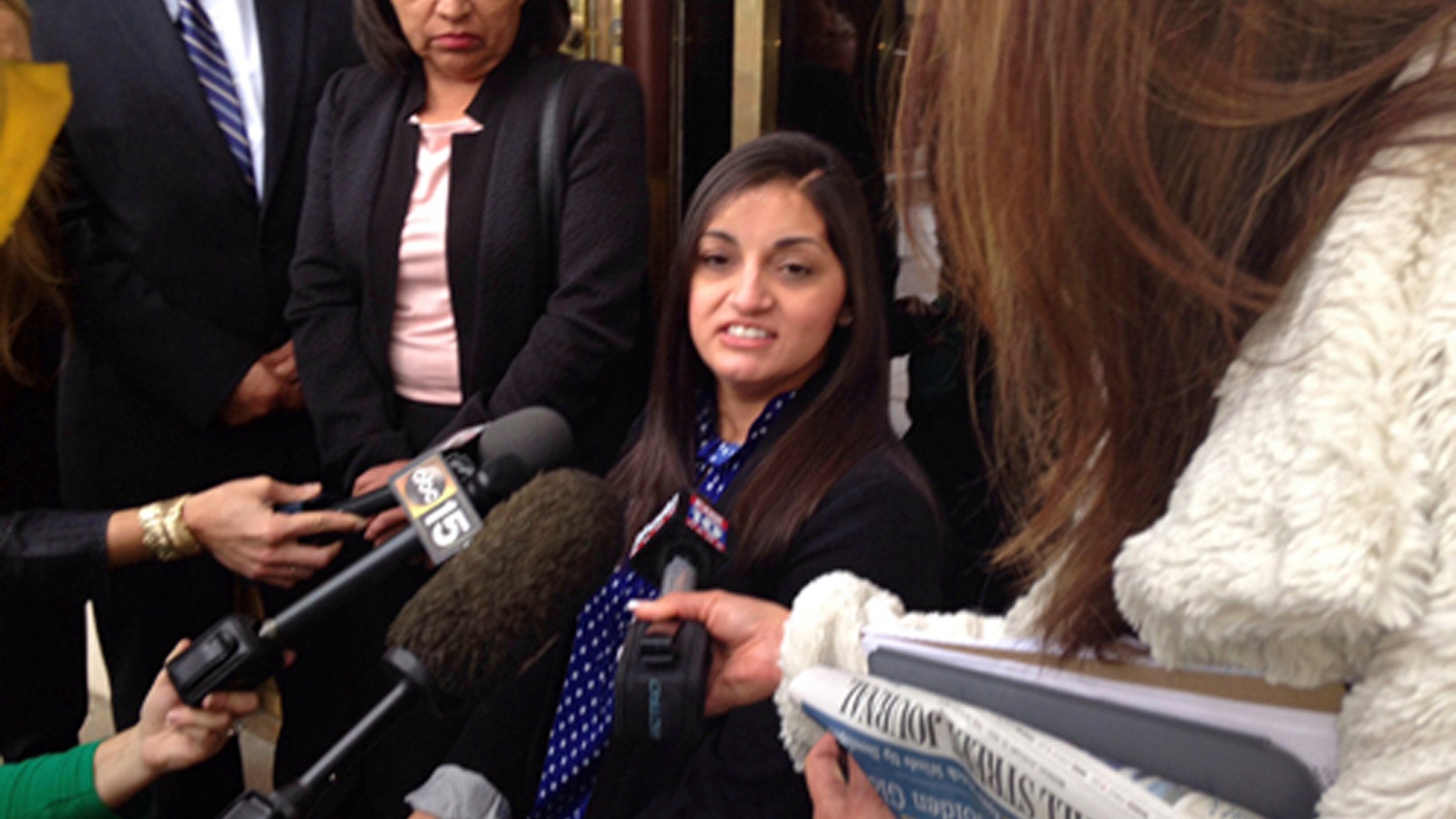 April "Abby" Guerra speaks to reporters in Phoenix Friday, May 8, 2015.