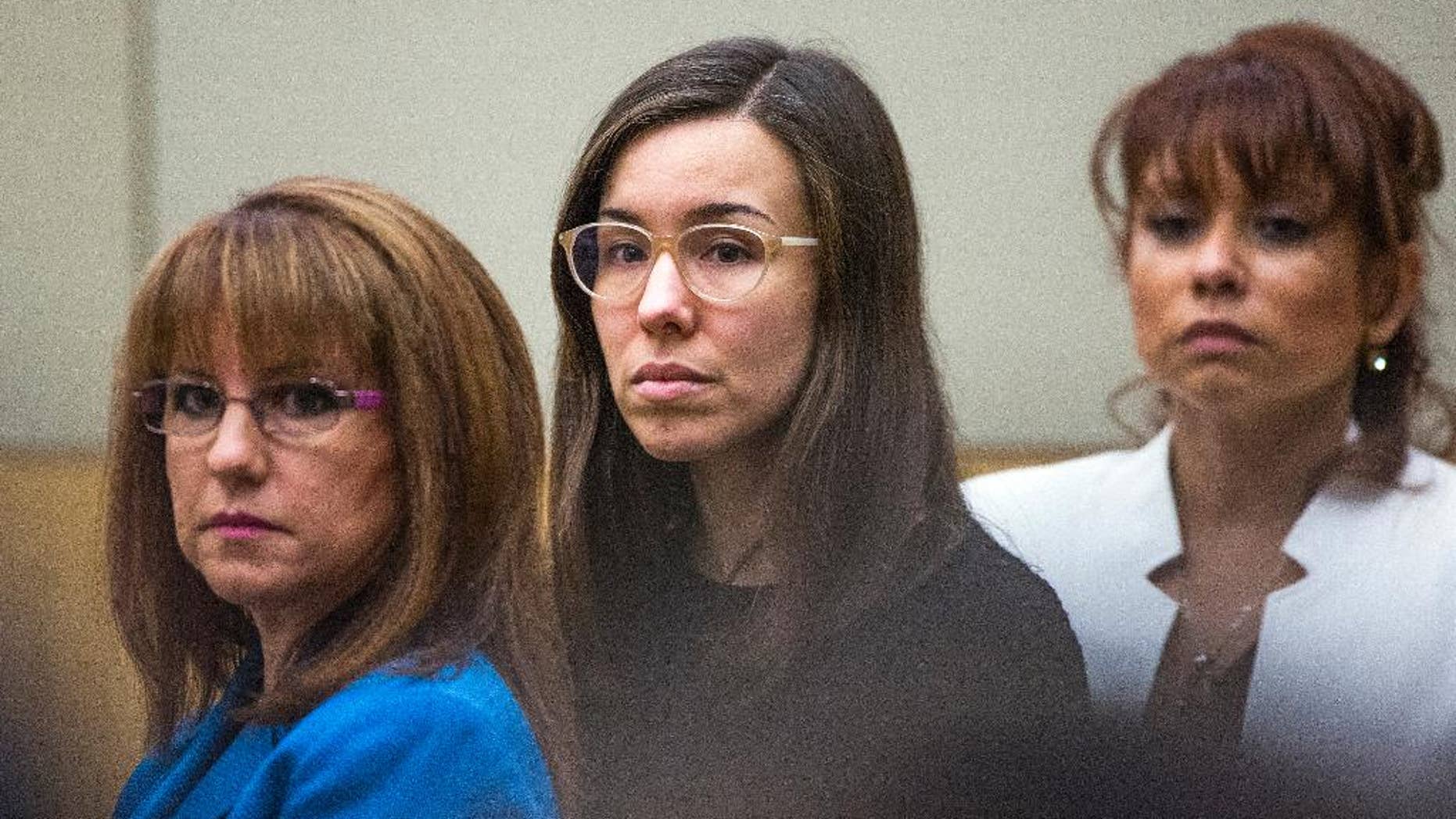FILE - Convicted murderer Jodi Arias, center, watches the jury enter the courtroom before hearing their verdict in this March 5, 2015 file photo taken in Maricopa County Superior Court in Phoenix. A court document released Tuesday March 10, 2015 by the judge in the case reveals the behind-the-scenes wrangling in the jury room as Arias' fate hung in the balance. (AP Photo/The Arizona Republic, Tom Tingle, Pool, File)