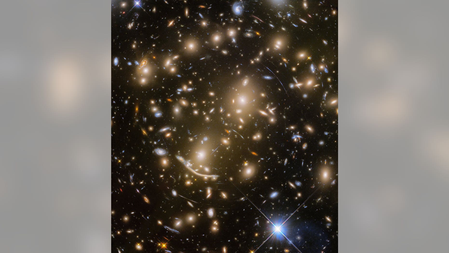 This new Hubble view features a distant galaxy cluster called Abell 370. It also captures numerous cosmic objects that are magnified by the powerful gravitational force of the galaxy cluster.