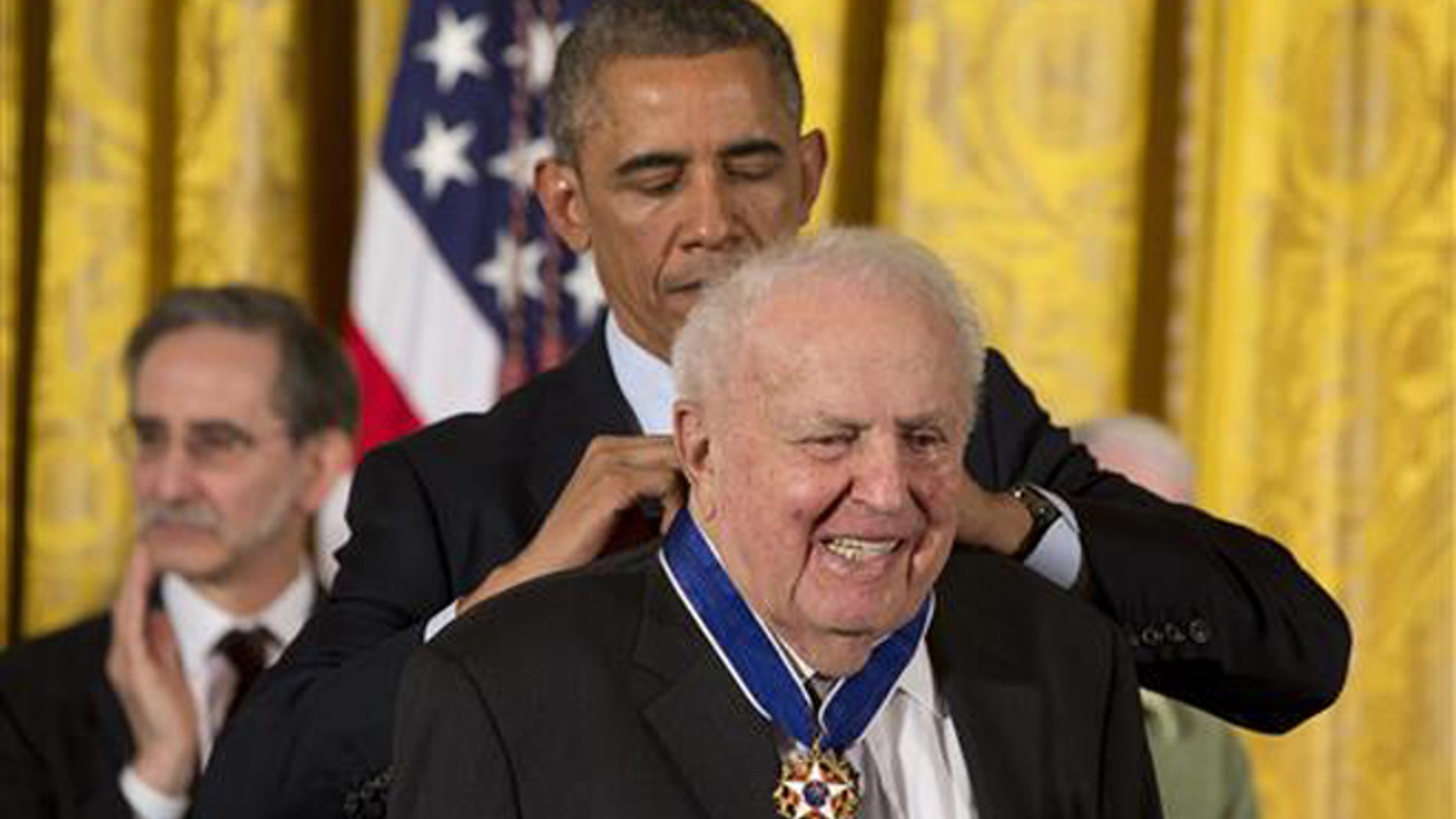 In this Nov. 24, 2014, file photo, President Barack Obama awards former Illinois Rep. Abner Mikva the Presidential Medal of Freedom during a ceremony in the East Room of the White House in Washington.