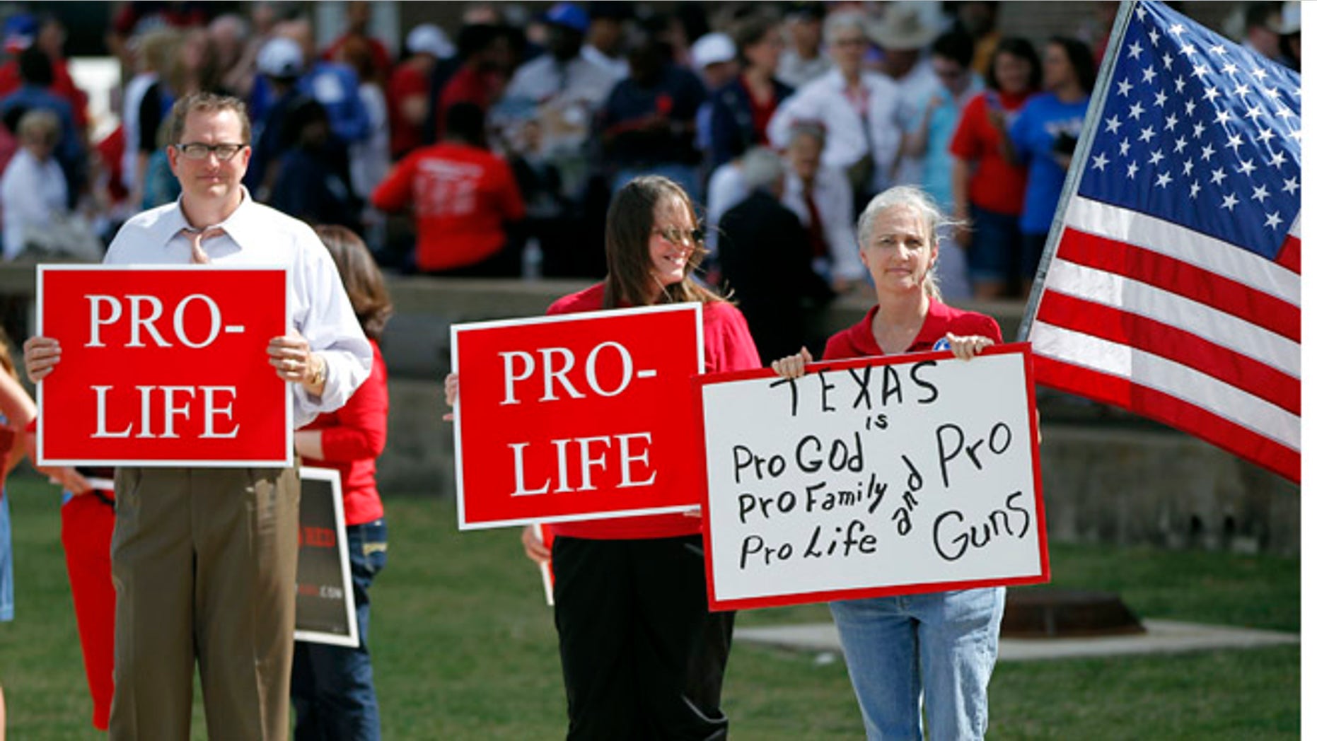 Oct.3 , 2013: Protesters gather outside W.G. Thomas Coliseum in Haltom City, Texas.