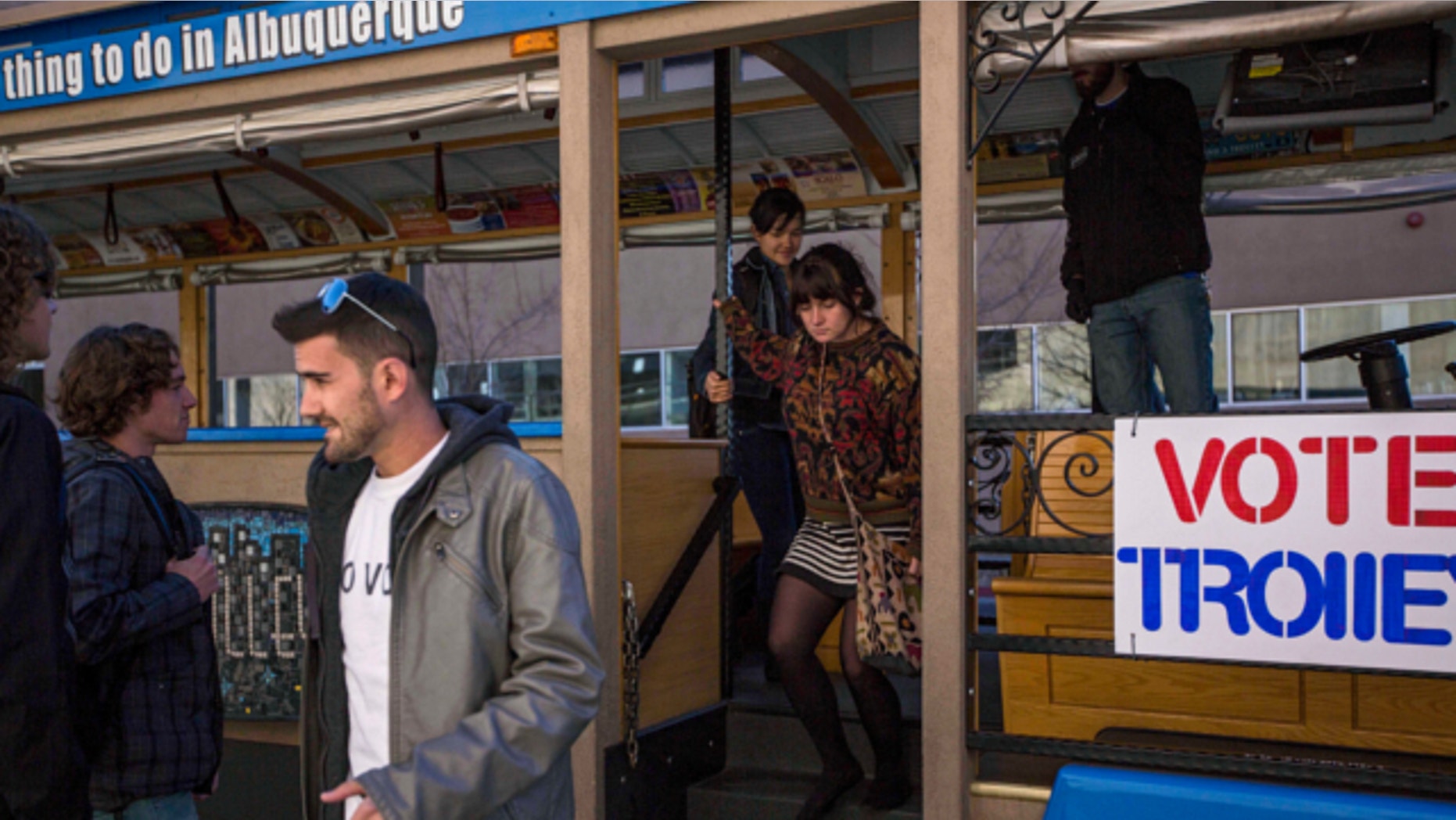 Nov. 14, 2013: University of New Mexico students exit the "Voting Trolly" at a stop on campus in Albuquerque, N.M.