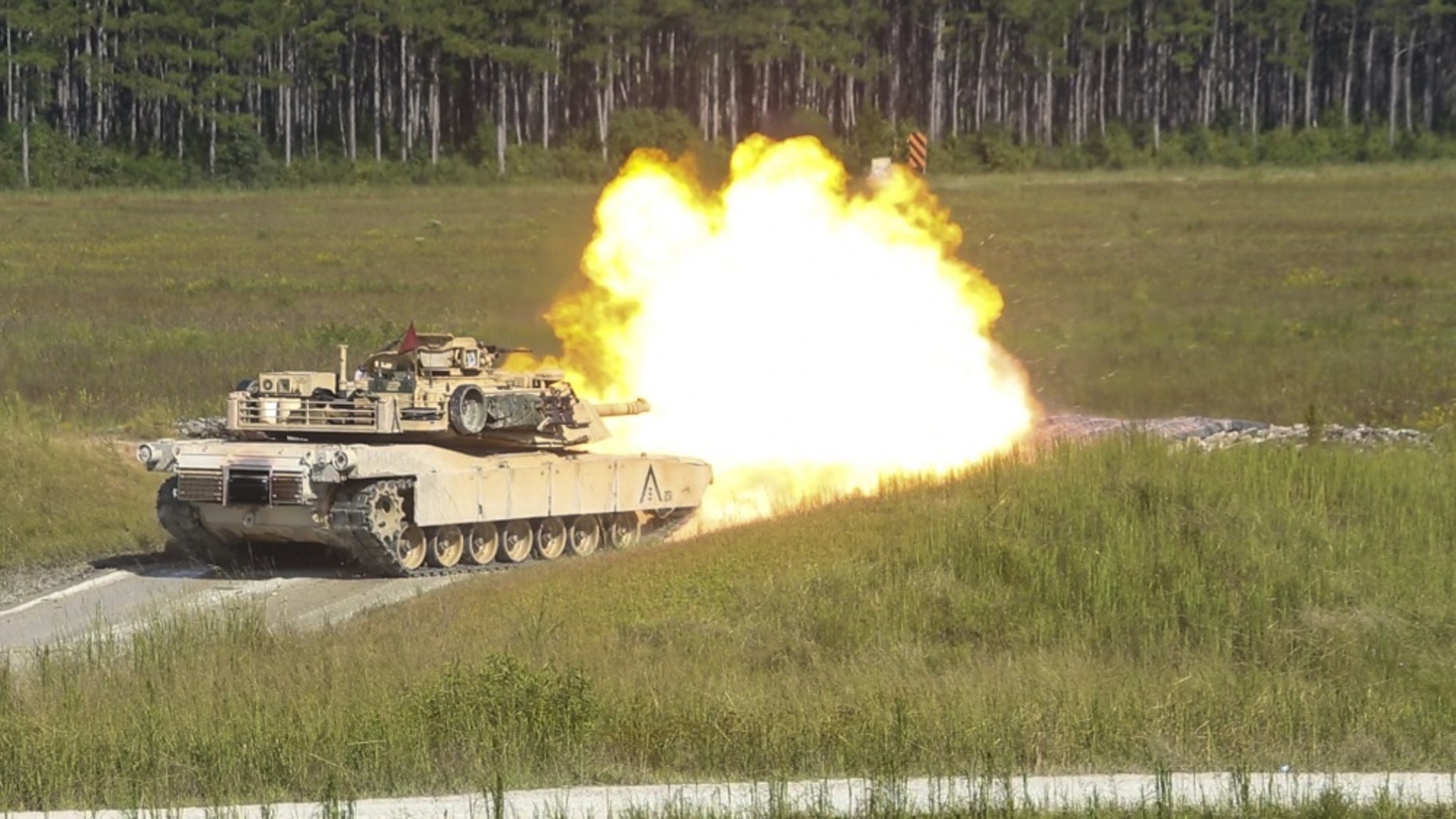 Marines fire an M1A1 Abrams tank during a gunnery range at Camp Lejeune, N.C., Sept. 19, 2017.