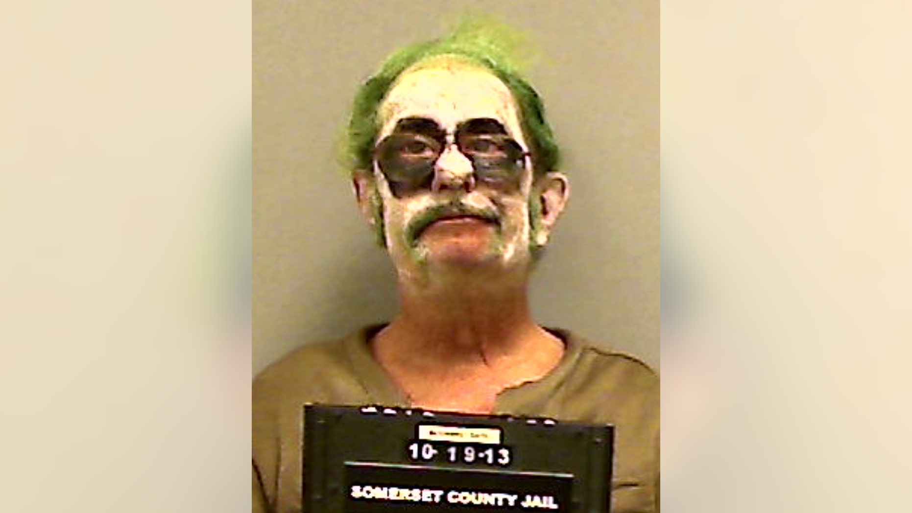 This booking photo provided by the Somerset County Sheriff’s Department shows Dennis Lalime, arrested Sunday, Oct. 20, 2013, when returning from a Halloween party made up as "The Joker," and charged with drunken driving after crashing his car in Pittsfield, Maine. (AP Photo/ Somerset County Sheriff’s Department)
