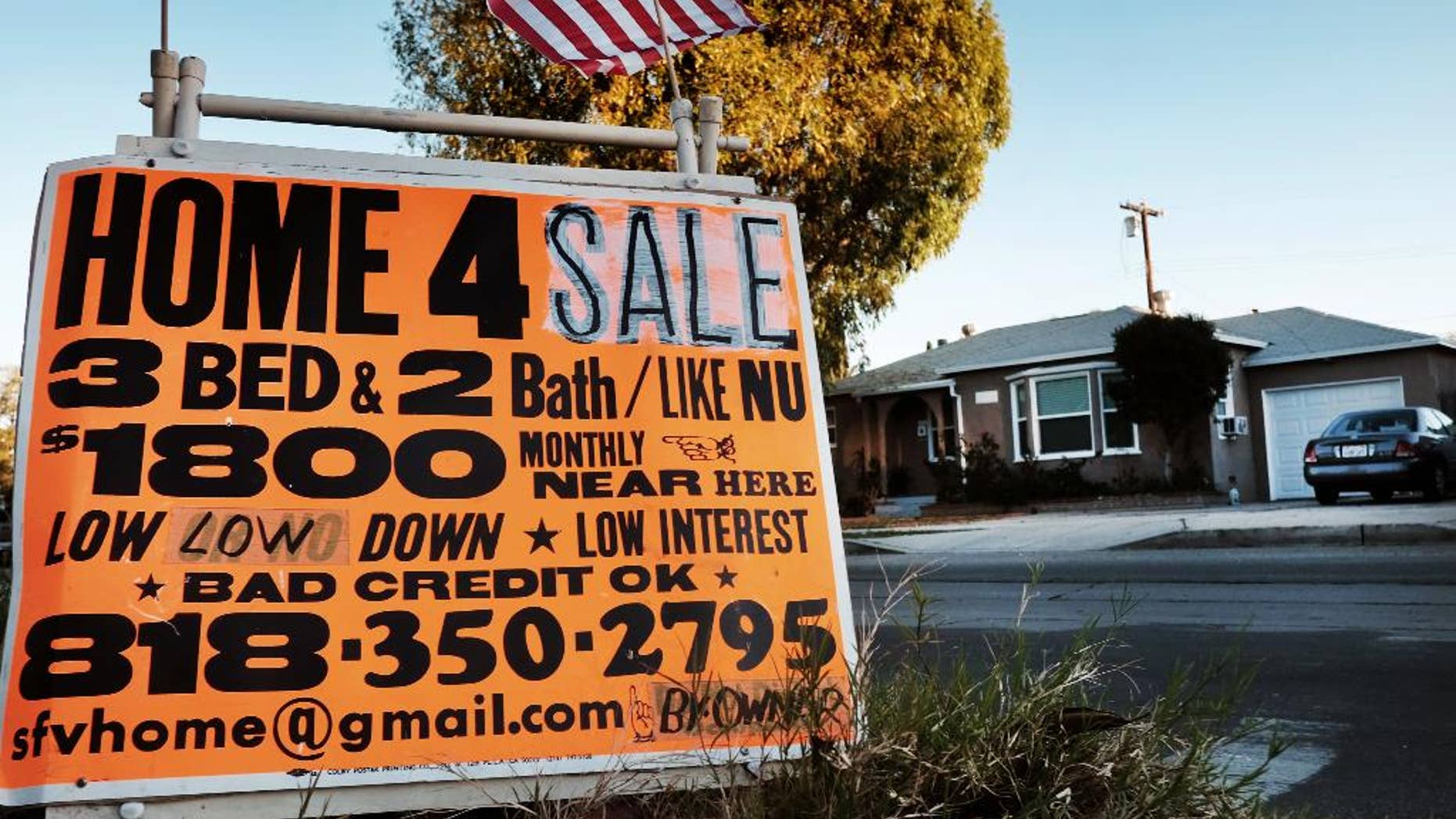 This Saturday, Jan. 17, 2015 photo shows a sign advertising a house for sale in Los Angeles. Standard & Poor’s releases its 20-city home price index for December and the fourth quarter on Tuesday, Feb. 24, 2015. (AP Photo/Richard Vogel)