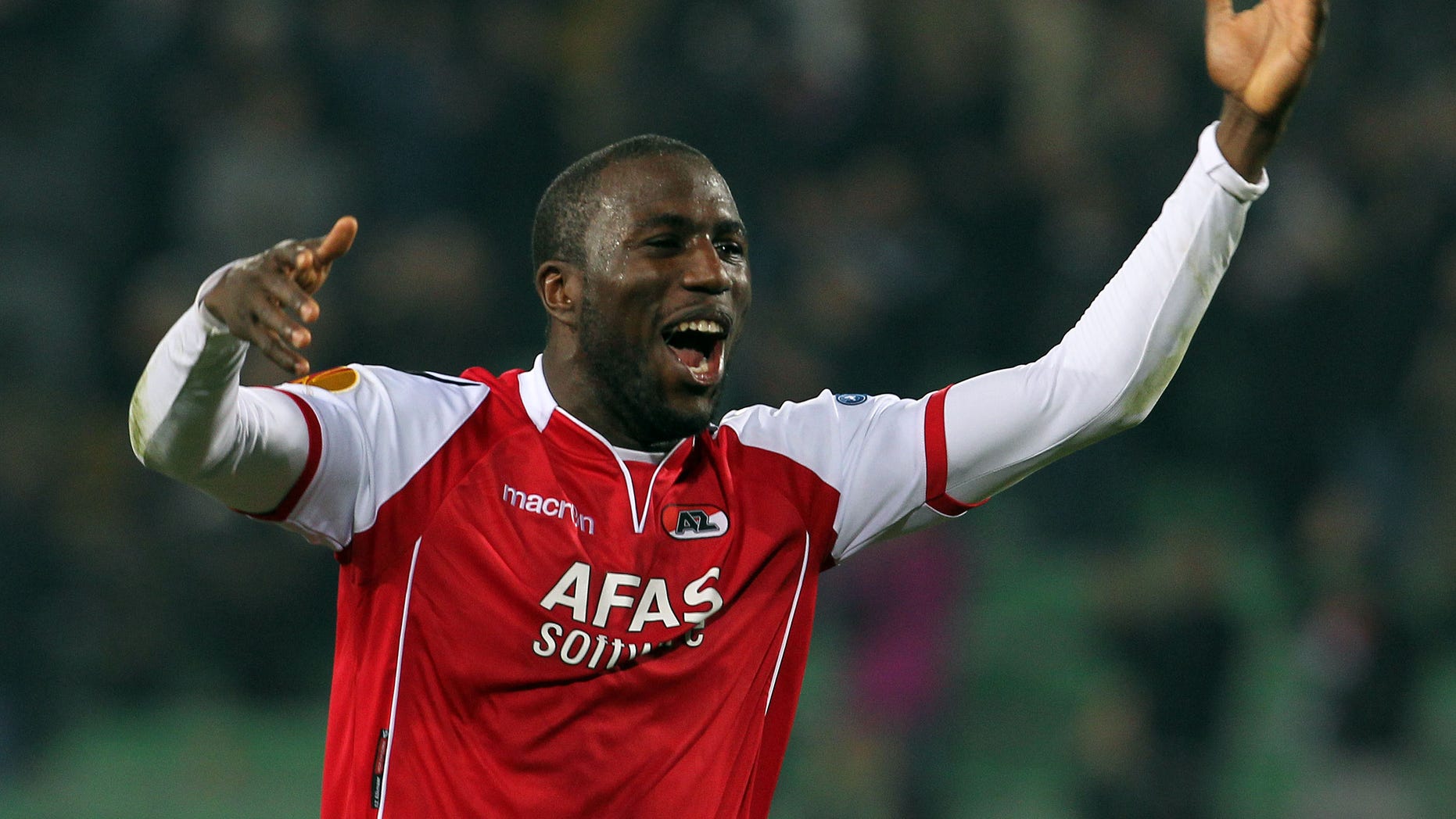 FILE - In this Thursday, March 15, 2012 file photo AZ Alkmaar's Jozy Altidore, of the United States, celebrates at the end of the Europa League, round of 16, second leg soccer match against Udinese at the Udine Friuli stadium, Italy. Dutch club FC Den Bosch is vowing to do all it can to identify and punish a group of fans who hurled racist abuse at AZ Alkmaar and United States striker Jozy Altidore during a cup quarterfinal. Den Bosch said Wednesday Jan. 30, 2012, that fans responsible for the monkey chants in the KNVB Cup tie “do not belong in the De Vliert (stadium) and will face the toughest possible sanctions.” (AP Photo/Paolo Giovannini, File)