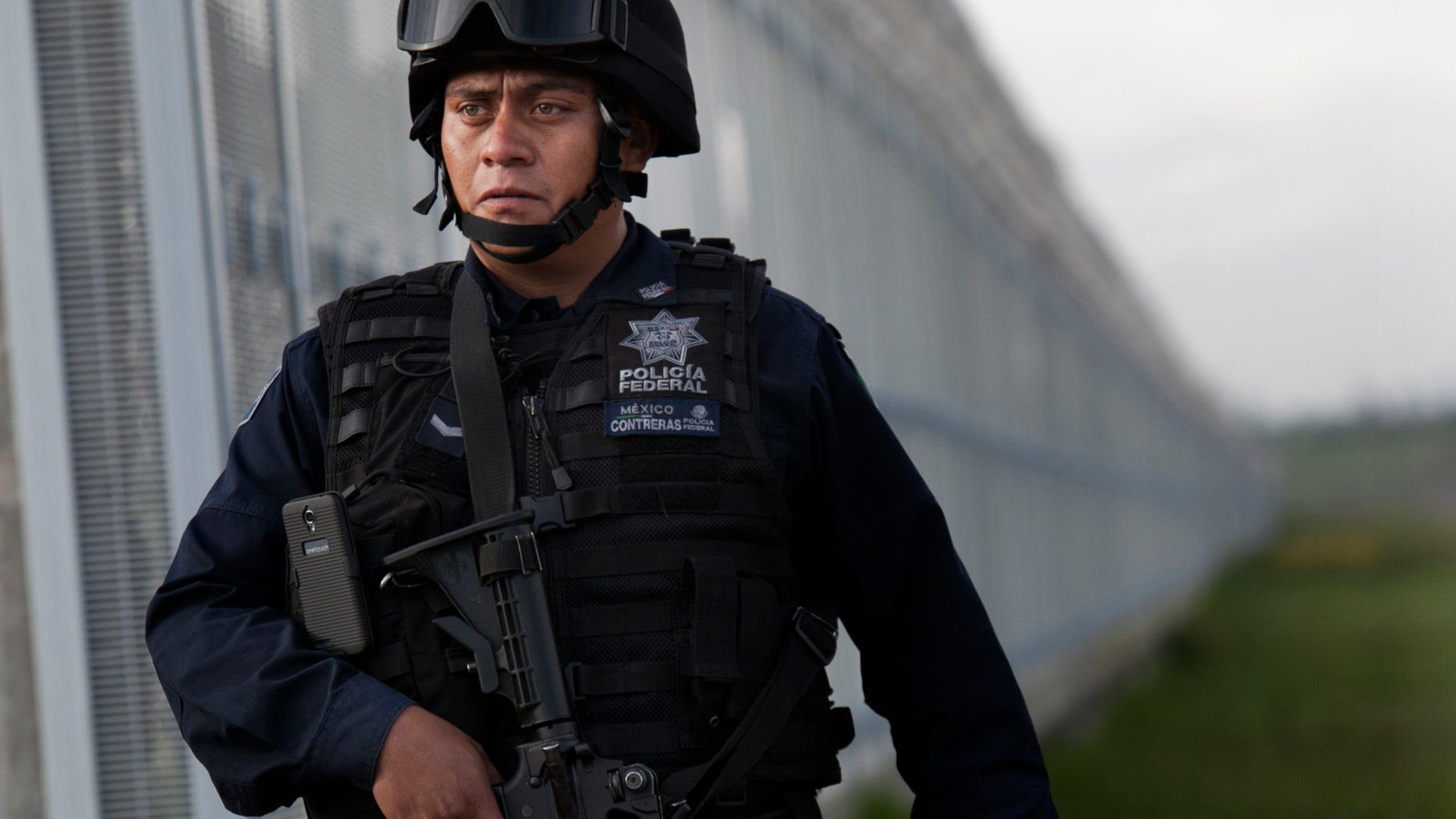 Federal police patrol near the Altiplano maximum security prison in Almoloya, Toluca, Mexico, early Sunday, July 12, 2015.