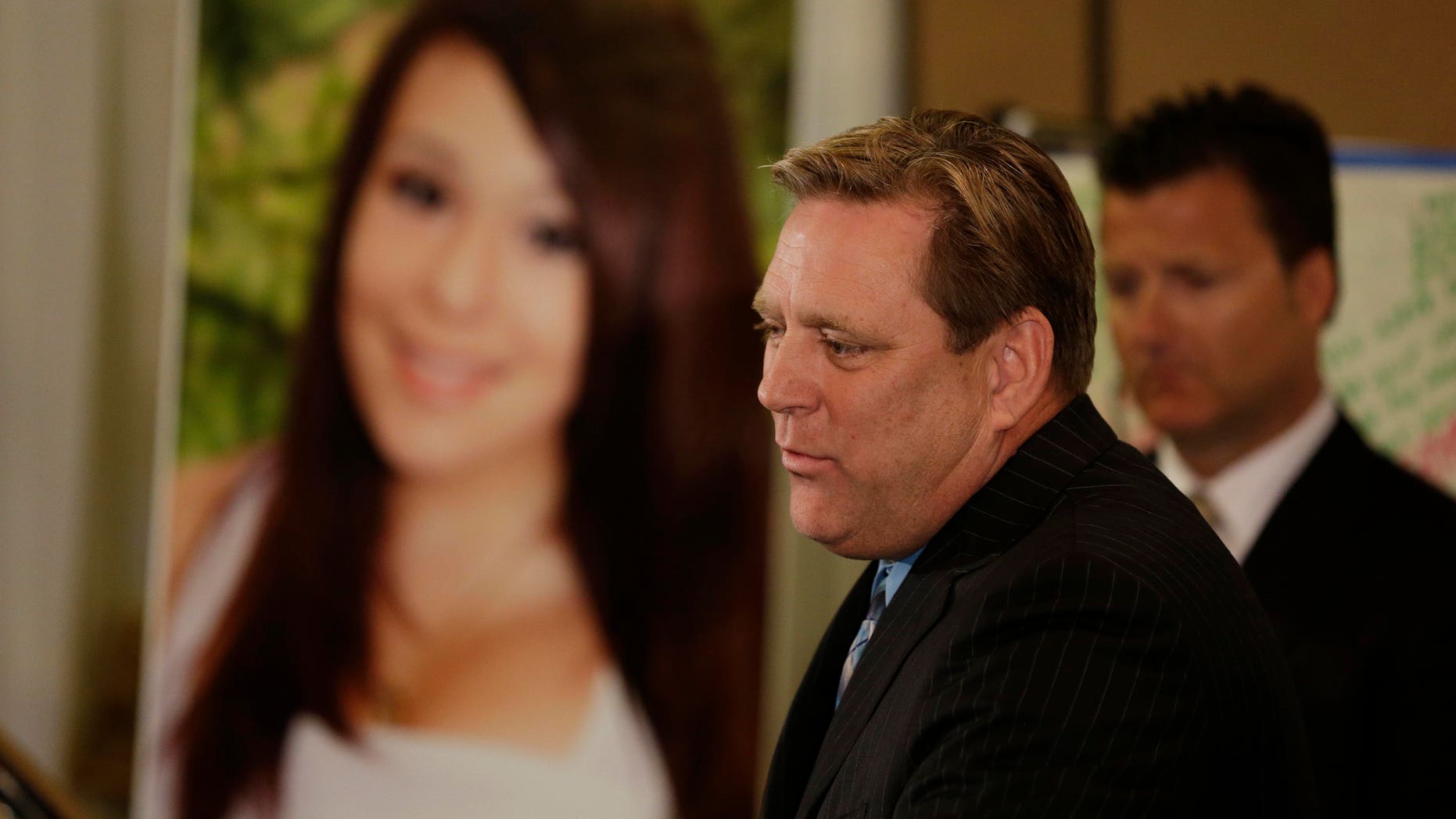 Larry Pott, father of Audrie Pott, who committed suicide after a sexual assault, talks about his daughter during a news conference Monday, April 15, 2013, in San Jose, Calif. At right is family representative Robert Allard. The family of a girl who committed suicide after she was sexually assaulted and a photo of the act was shared in text messages said Monday the three 16-year-old boys responsible were sober when the assault happened. (AP Photo/Eric Risberg)