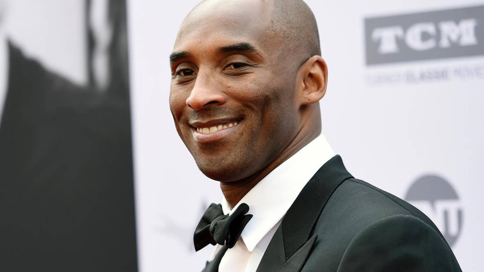 In this June 9, 2016 file photo, retired NBA basketball player Kobe Bryant poses at the 2016 AFI Life Achievement Award Gala Tribute to John Williams in Los Angeles.