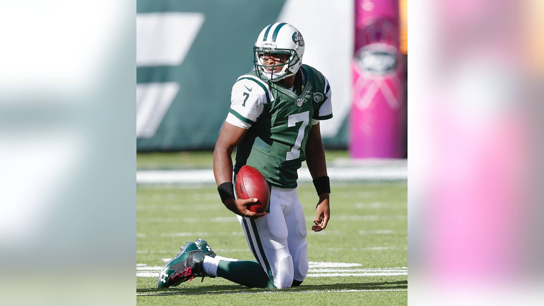 New York Jets quarterback Geno Smith (7) gets up off the turf after a sack from the Denver Broncos during the third quarter of an NFL football game, Sunday, Oct. 12, 2014, in East Rutherford, N.J. (AP Photo/Kathy Willens)