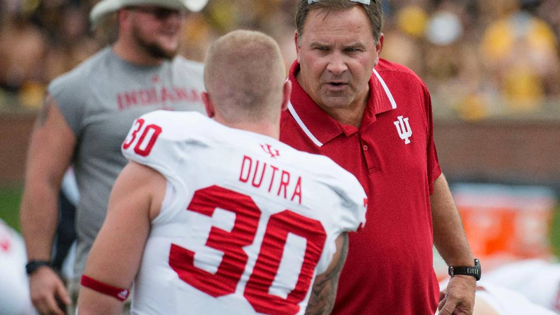 Indiana head coach Kevin Wilson, right, talks with player Chase Dutra before the start of an NCAA college football game against Missouri, Saturday, Sept. 20, 2014, in Columbia, Mo. (AP Photo/L.G. Patterson)