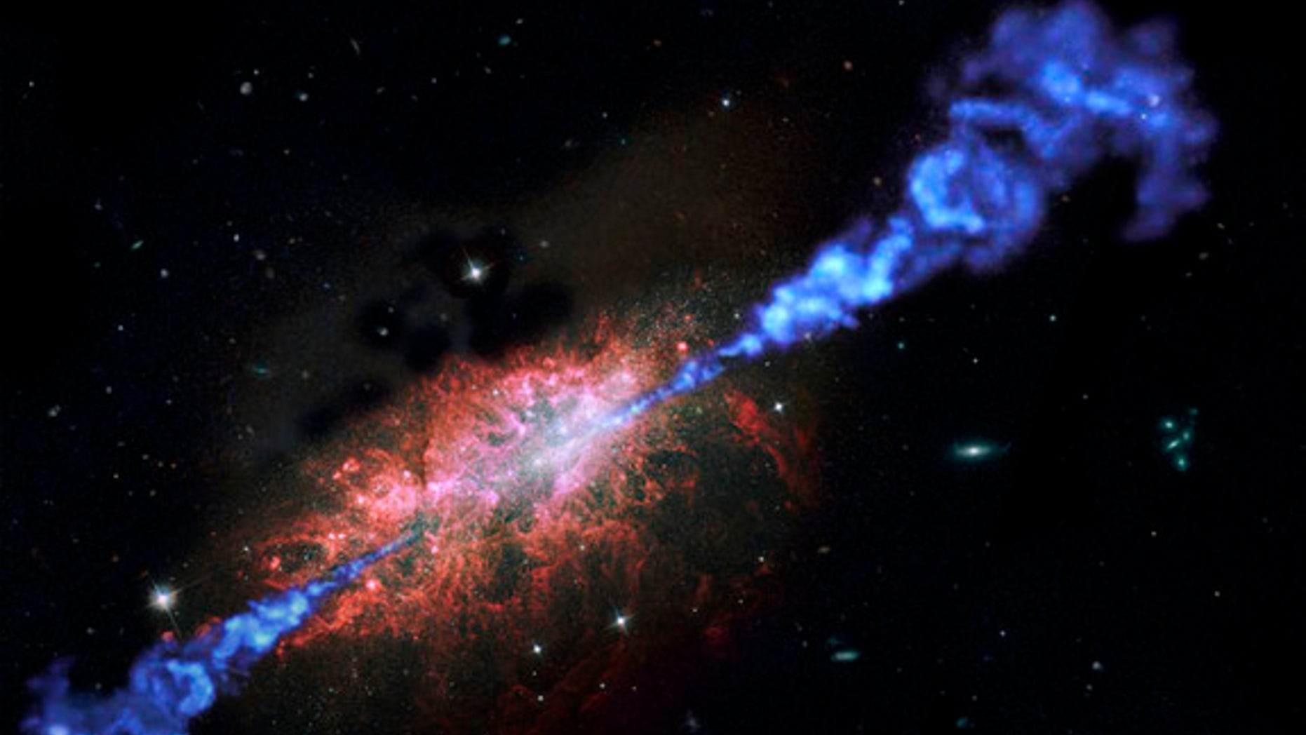 Artist's impression of a distant active galaxy firing off jets of powerful radiation.