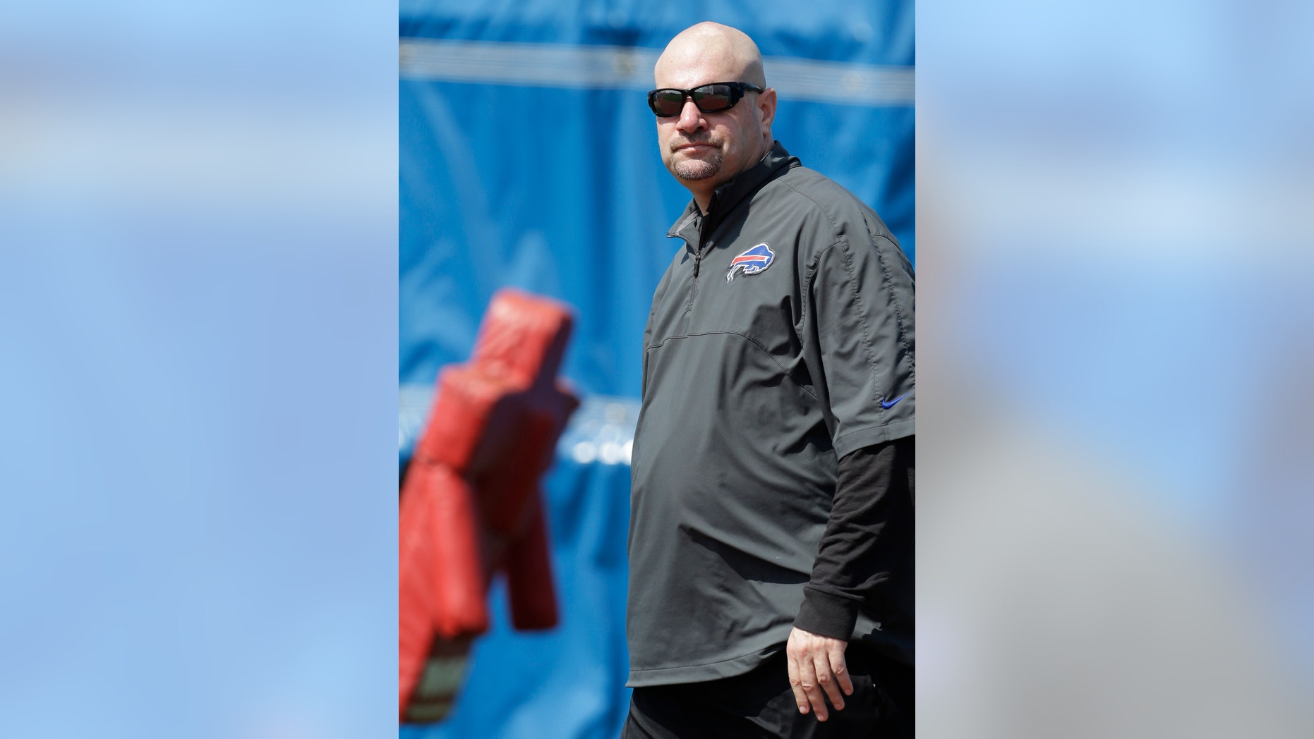 FILE - In this May 20, 2013 file photo, Buffalo Bills new defensive coordinator Mike Pettine looks on during an optional NFL football workout in Orchard Park, N.Y. When it comes to putting together his defense, Pettine's intention is to keep opponents guessing. (AP Photo/David Duprey, File)