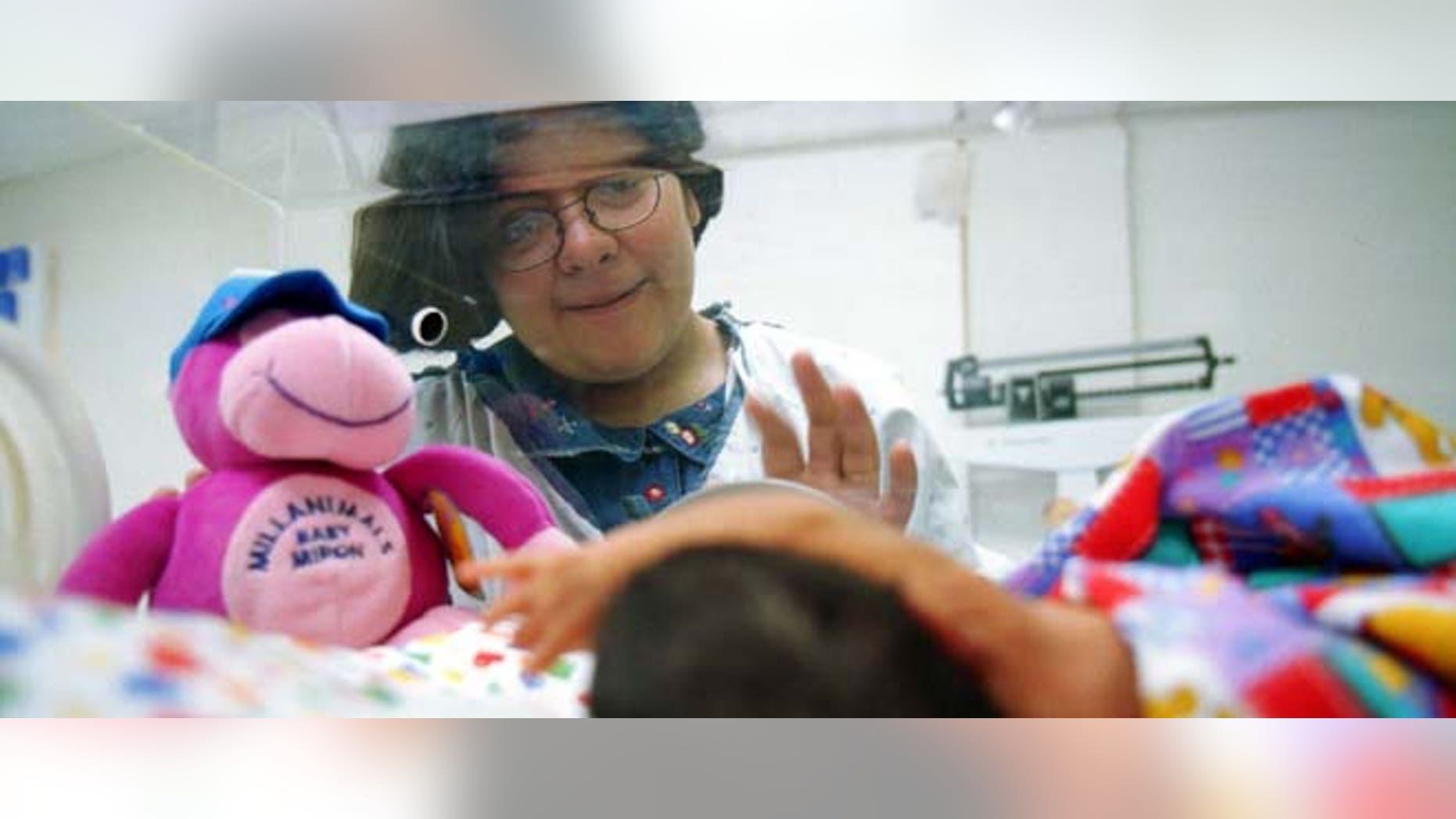 F364539 04: Marco Antonio rests in an incubator February 14, 2000 as his mother Claudia Chavarria waves in the new neonatal center in Agua Prieta, Mexico called Proyecto Neovida. In Arizona, state and federal data show that the birthrate among Latinas is declining. (Photo by Joe Raedle)Center and University Medical Center, also in Tucson. (Photo by Joe Raedle)