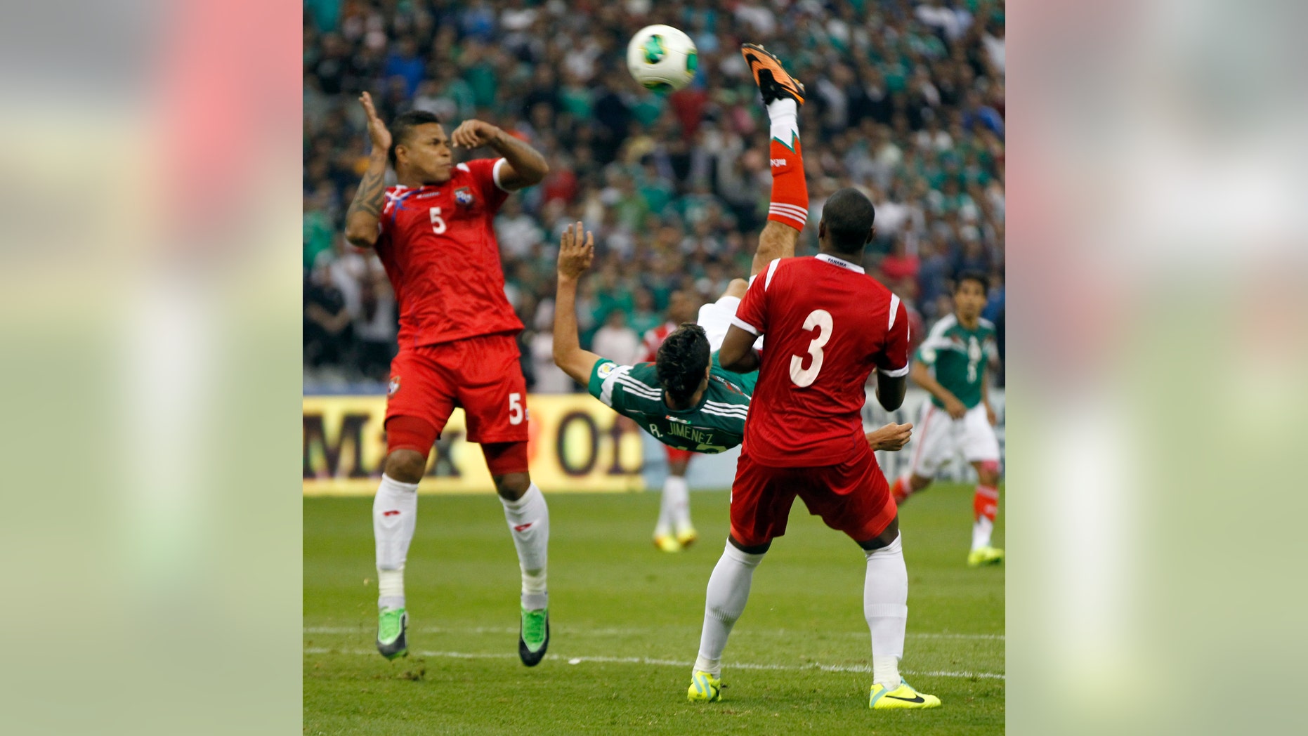 Mexico's Raul Jimenez, center, shoots to score the winning goal against Panama at a 2014 World Cup qualifying match, in Mexico City, Friday, Oct. 11, 2013. Mexico defeated Panama 2-1. (AP Photo/Eduardo Verdugo)