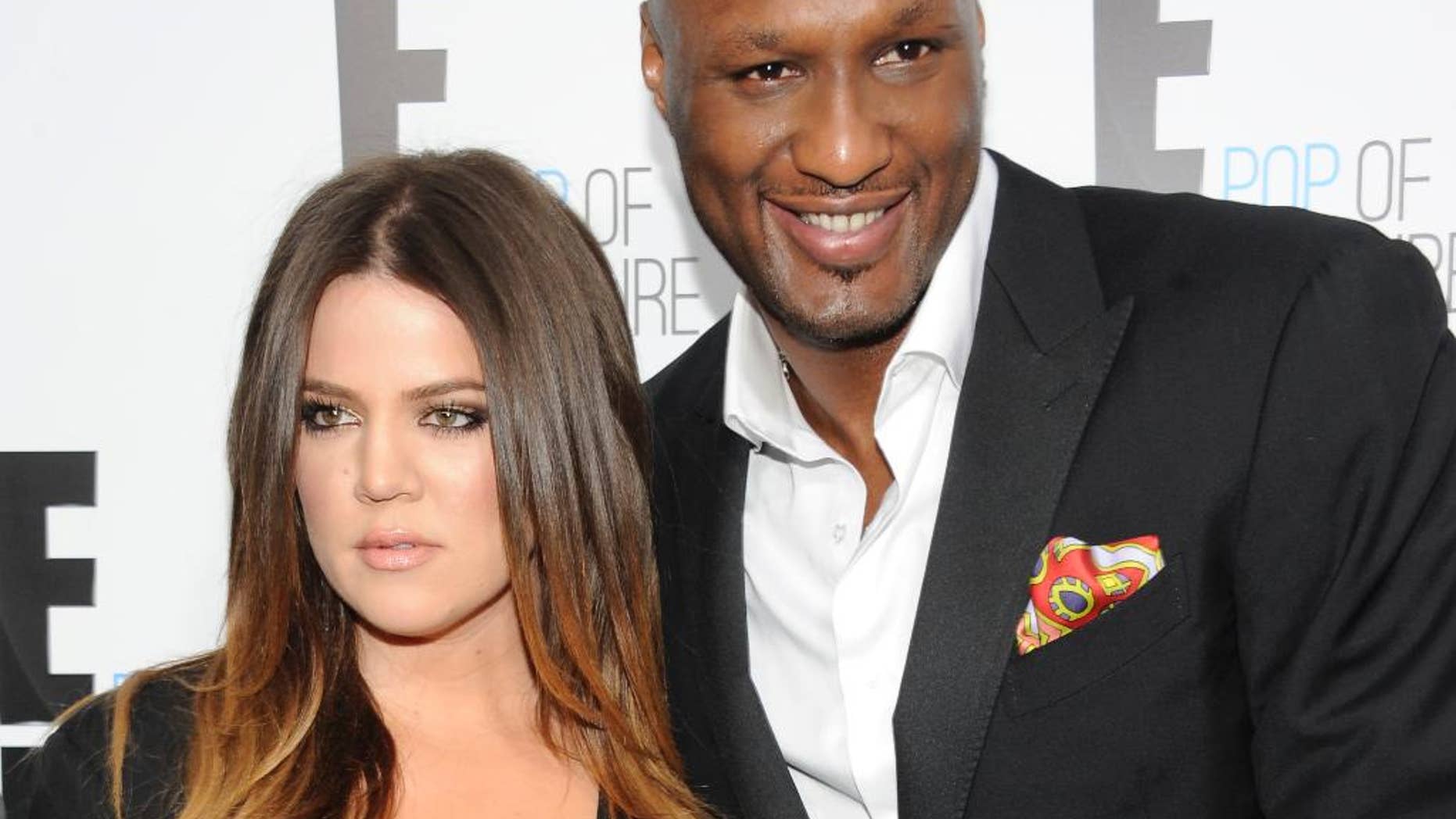 FILE - In this April 30, 2012, file photo, Khloe Kardashian Odom and Lamar Odom from the show "Keeping Up With The Kardashians" attend an E! Network upfront in New York. Kardashian filed for divorce from Odom for the second time on Thursday, May 26, 2016, citing irreconcilable differences. The pair married in September 2009 and broke up in late 2013, but Kardashian withdrew her first divorce petition after Odom was found unconscious at a Nevada brothel last year and required serious medical treatment. (AP Photo/Evan Agostini, File)