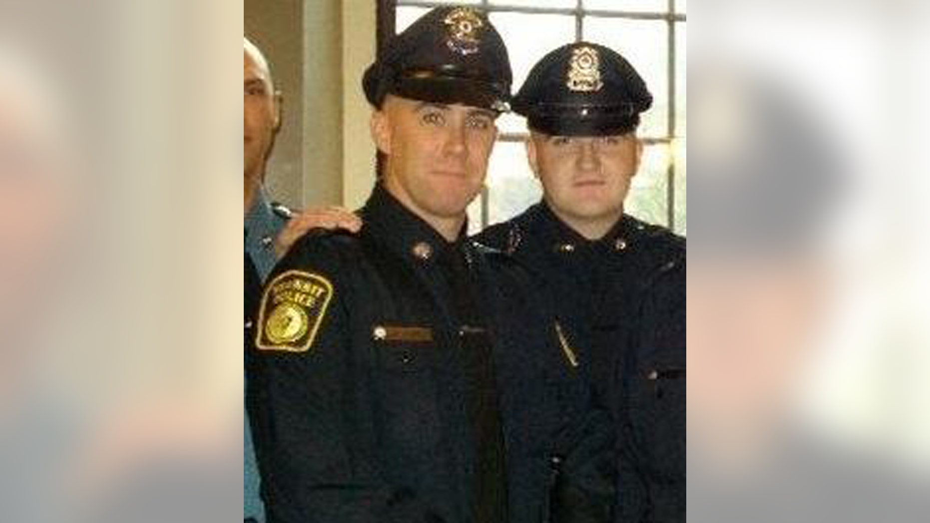 In this 2010 photo provided by the Massachusetts Bay Transportation Authority, Richard Donohue Jr., left, and Sean Collier pose together for a photo at their graduation from the Municipal Police Officers' Academy. On Thursday, April 18, 2013, Massachusetts Institute of Technology Police Officer Collier was fatally shot on the MIT campus, and transit police officer Donohue was shot and critically wounded. Authorities allege that Boston Marathon bombing suspects Tamerlan and Dzhokhar Tsarnaev were responsible. (AP Photo/Massachusetts Bay Transportation Authority)