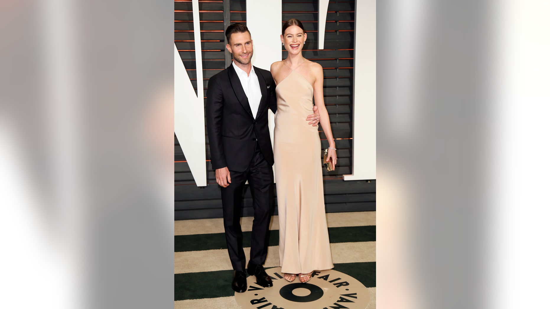 February 22, 2015. Musician Adam Levine and wife, model Behati Prinsloo, arrive at the 2015 Vanity Fair Oscar Party in Beverly Hills, California.
