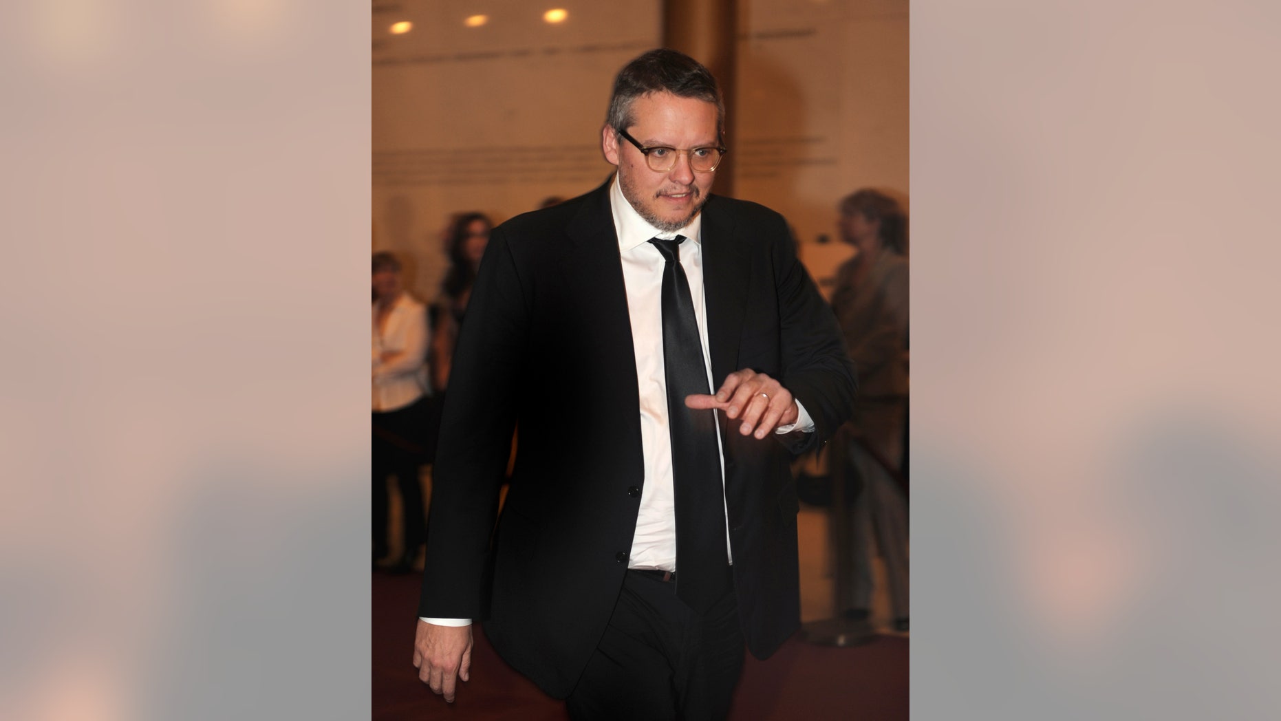 October 23, 2011. Comedian and actor Adam McKay walks past photographers on the red carpet as he arrives at the Kennedy Center, to attend the 14th Annual Mark Twain Prize for American Humor, honoring comedian and actor Will Ferrell, in Washington.