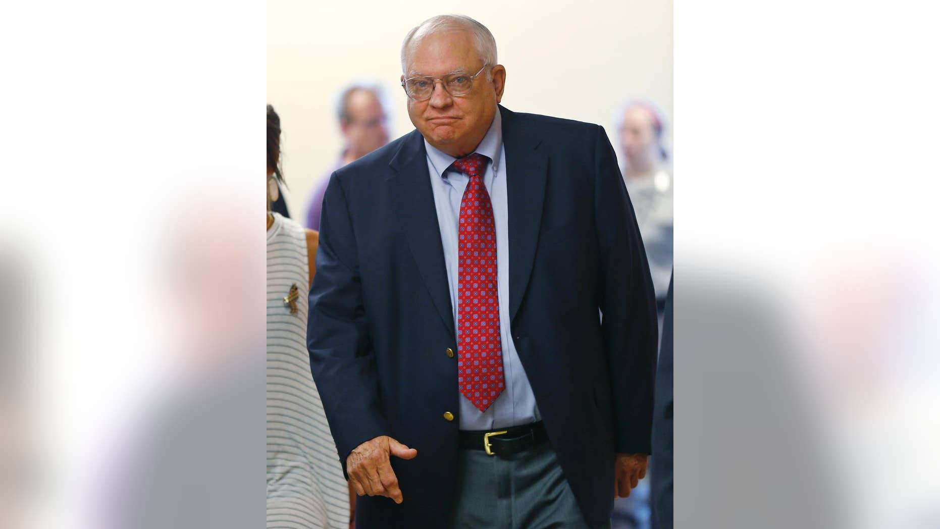 FILE - In this July 13, 2015, file photo, Robert Bates arrives for his arraignment in Tulsa, Okla. The former Oklahoma volunteer deputy is charged with second-degree manslaughter in the fatal shooting of an unarmed man. Video released by an Oklahoma sheriff's office shows Bates pointing a stun gun at a suspected drug dealer and briefly drawing his firearm just weeks before he fatally shot an unarmed man. (AP Photo/Sue Ogrocki, File)