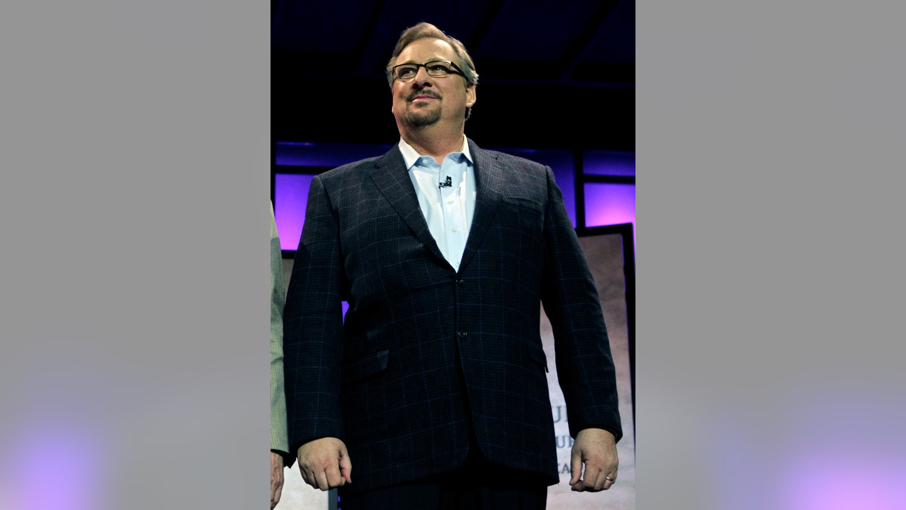 FILE - In this Nov. 29, 2010, file photo, Pastor Rick Warren acknowledges audience members during the Saddleback Civil Forum on Leadership and Service in Lake Forest, Calif. Saddleback Valley Community Church said in a statement Saturday, April 6, 2013, that Warren's 27-year-old son, Matthew Warren, has committed suicide after struggling with mental illness and deep depression. (AP Photo/Jae C. Hong, File)