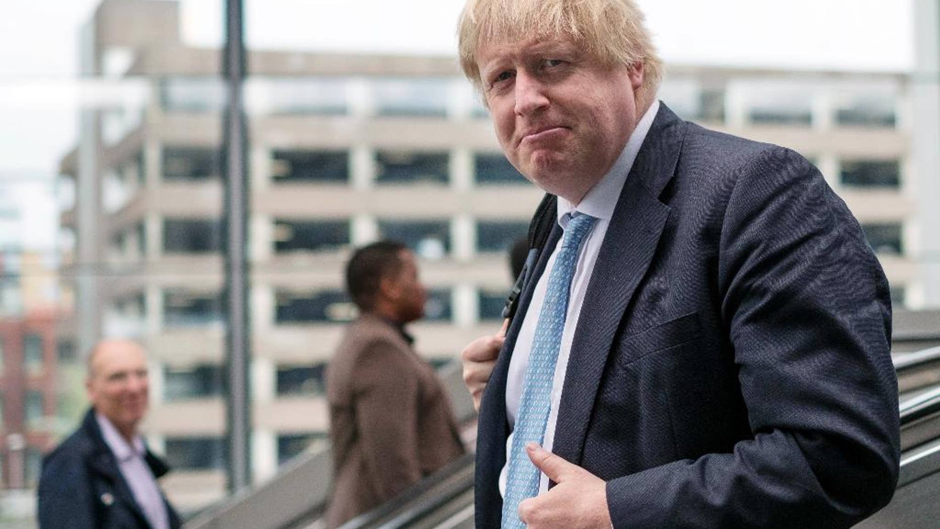 Boris Johnson arrives at Reading railway station for a day of campaigning as part of the Vote Leave EU referendum campaign, in Reading, England, Monday June 13, 2016. Polls suggest the June 23 vote on whether to leave the 28-nation bloc could go either way. (Stefan Rousseau/PA Photo via AP) UNITED KINGDOM OUT