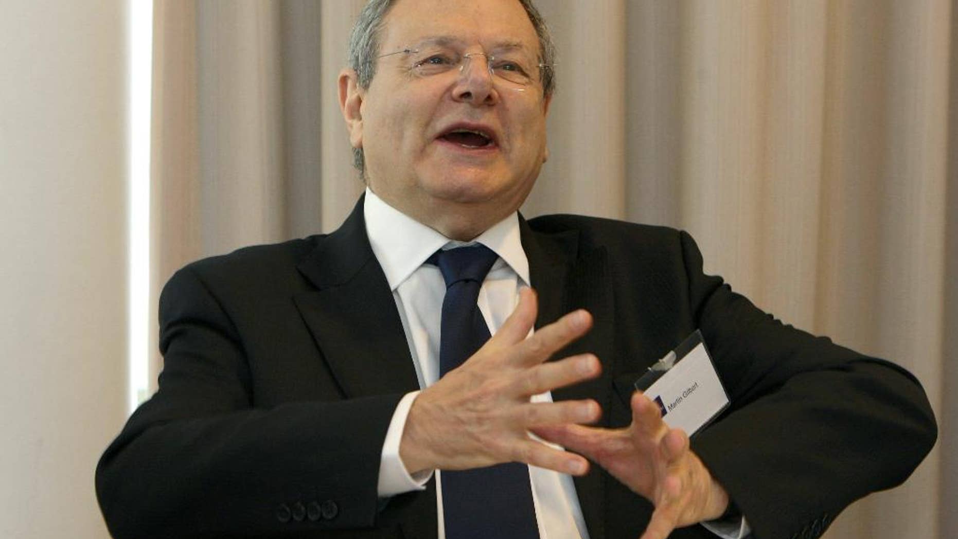 FILE - In this Oct. 16, 2009 file photo, Martin Gilbert, a member of the Iraq Inquiry panel, speak in Manchester, England. The chair of the inquiry into the Iraq war says that Winston Churchill’s official biographer, Martin Gilbert, has died. Inquiry chairman John Chilcot paid tribute Tuesday Feb. 3, 2015 to Gilbert, who was a member of the panel investigating the war. (AP Photo/PA, Dave Thompson, File) UNITED KINGDOM OUT NO SALES NO ARCHIVE
