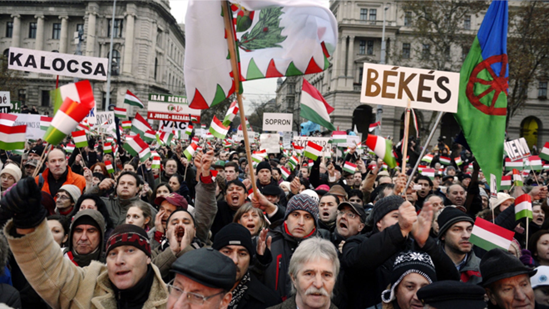 Dec. 2, 2012: Participants wave Hungarian national flags and a flag of Romas, right, as thousands of people attend a protest called Mass Demonstration Against Nazism in front of the Parliament building (unseen) in Budapest, Hungary.