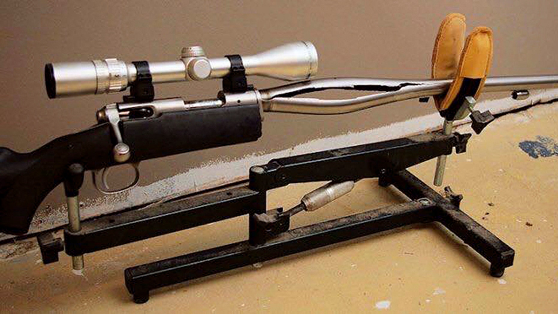 In this 2009 photo provided by Trent Procter, a Savage Arms stainless steel 10ML-II muzzleloader owned by Procter of Swan River, Manitoba, Canada, is displayed weeks after its barrel exploded and severely injured his left hand.