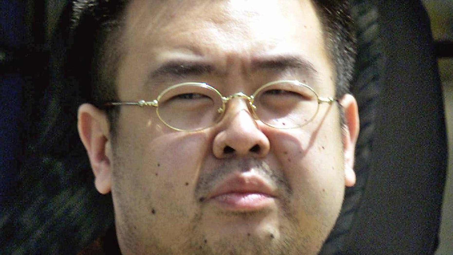 FILE - This May 4, 2001, file photo shows Kim Jong Nam, exiled half brother of North Korea's leader Kim Jong Un, in Narita, Japan. Kim Jong Nam, 46, was targeted Monday, Feb. 13, 2017, in the Kuala Lumpur International Airport, Malaysia, and later died on the way to the hospital according to a Malaysian government official. Malaysia’s Deputy Prime Minister Ahmad Zahid Hamidi says the identity of Kim Jong Nam, who was killed last month, was confirmed with the DNA sample from one of his children. (AP Photos/Shizuo Kambayashi, File)