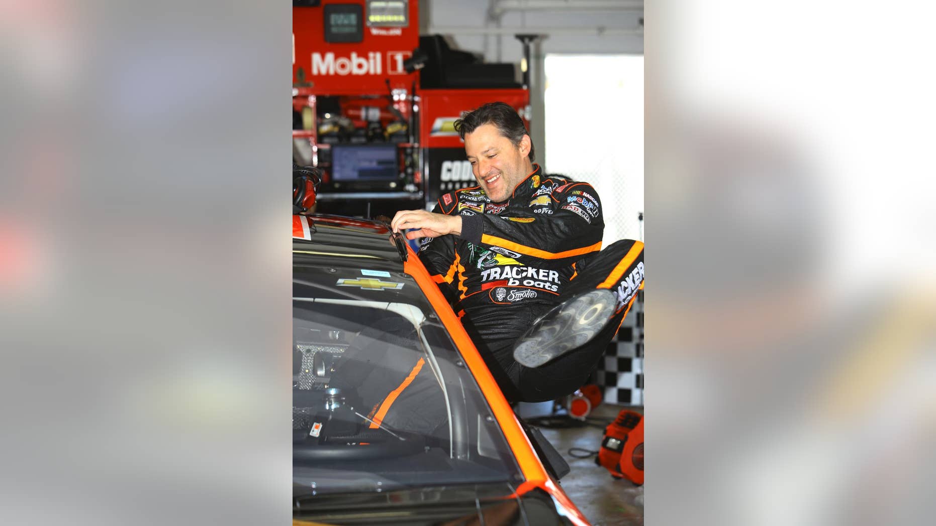 NASCAR driver Tony Stewart gets in his car before practice at Homestead-Miami Speedway, Friday, Nov. 14, 2014, in Homestead, Fla. (AP Photo/David Graham)