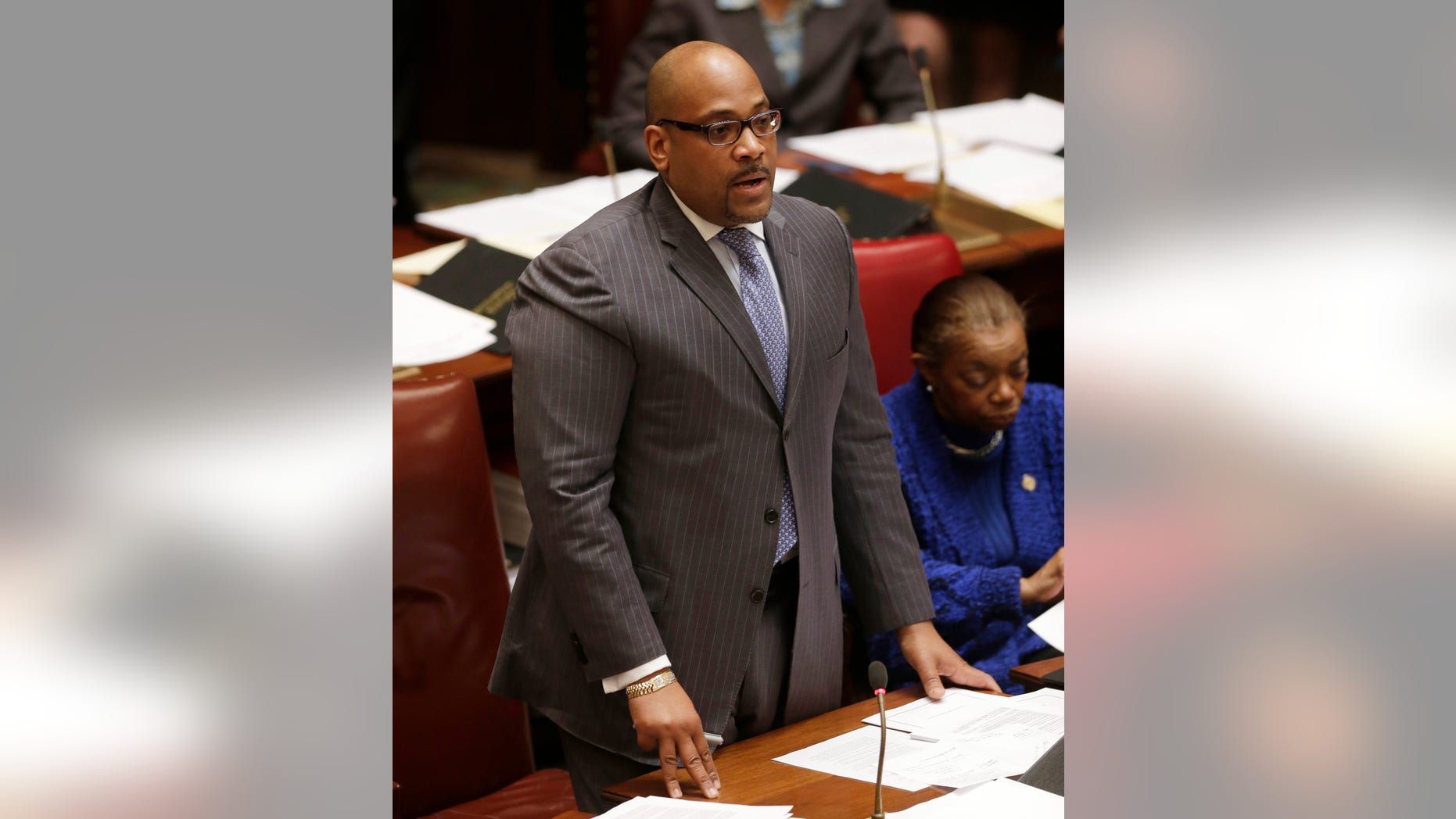 FILE - In this file photo of Feb. 11, 2013, Sen. John Sampson, D-Brooklyn, speaks in the Senate in Albany, N.Y. Sampson was arrested Monday, May 6, 2013, by the FBI in the latest corruption case brought by federal prosecutors. The Brooklyn Democrat was to appear later in the day at a Brooklyn courthouse. Specific charges weren't immediately announced. (AP Photo/Mike Groll, File)