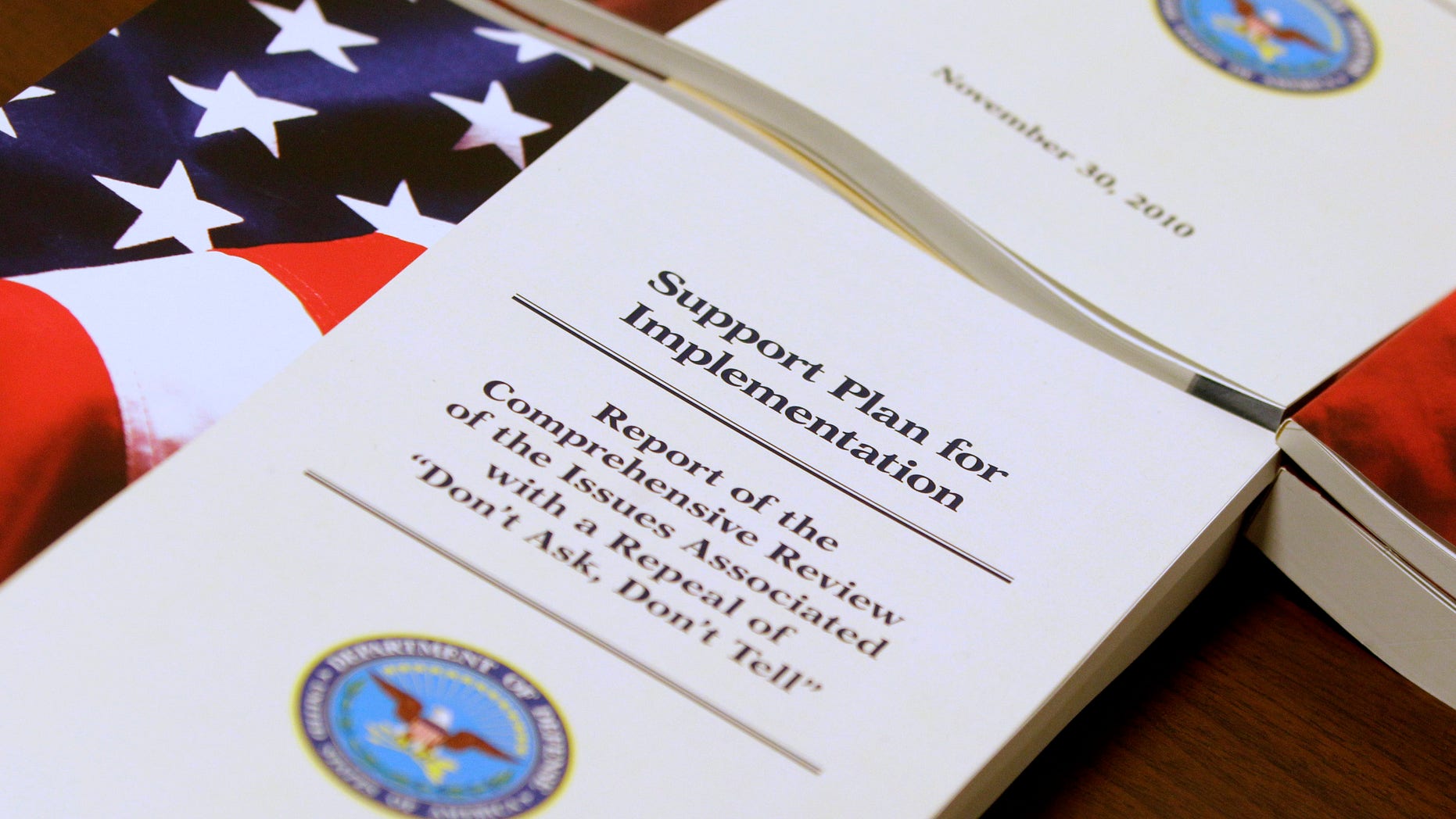 A report of a Pentagon survey on the issues associated with a repeal of "Don't Ask, Don't Tell" is seen on a table,at the Pentagon, Tuesday, Nov. 30, 2010, after Defense Secretary Robert Gates and Joint Chiefs Chairman Adm. Mike Mullen spoke to reporters on gays in the military. (AP Photo/Charles Dharapak)