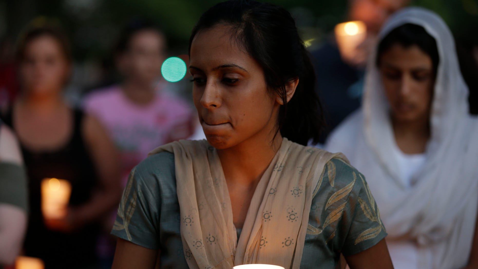 Aug 5, 2012: Mourners take part in a candle light vigil for the victims of the Sikh Temple of Wisconsin shooting, in Milwaukee.