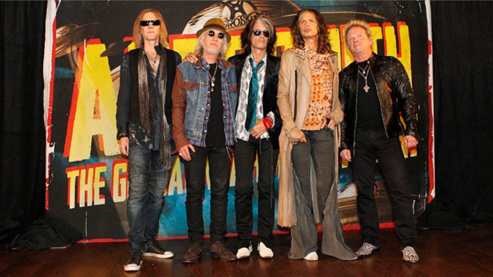 September 12, 2012. Rock band Aerosmith (L-R) Tom Hamilton, Brad Whitford, Joe Perry, Steven Tyler and Joey Kramer pose while promoting their upcoming album "Music from Another Dimension!" in West Hollywood.